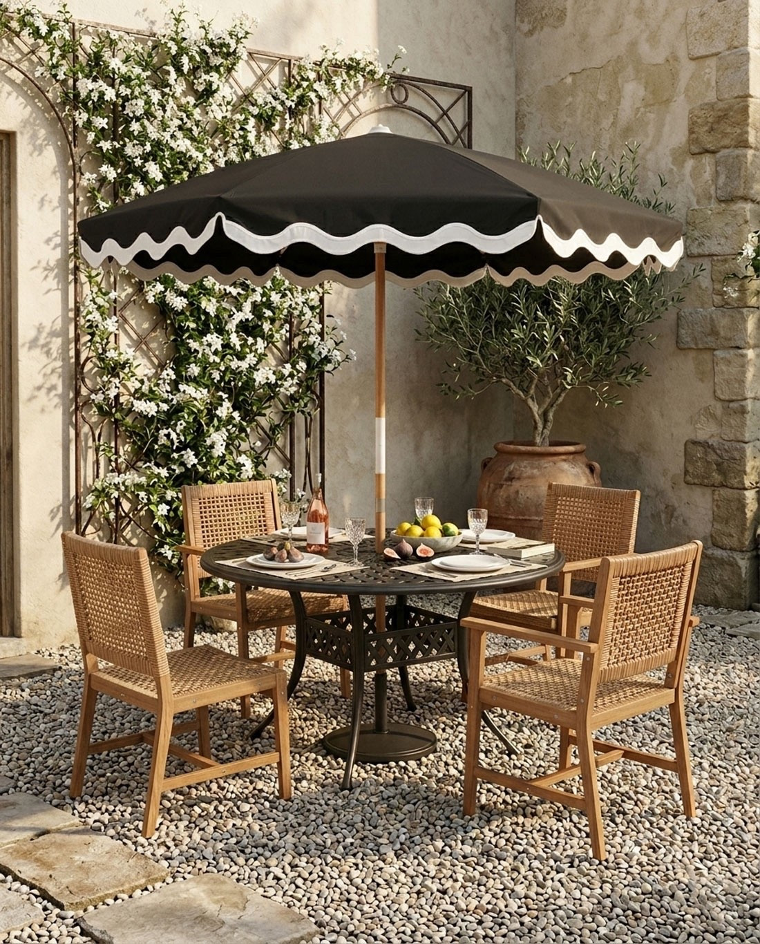 These outdoor wicker & wood chairs are low maintenance and only $112. Linked the table & umbrella + many others as well!

#LTKSeasonal #LTKHome