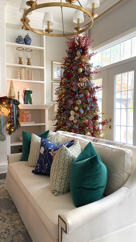 Our Christmas decor in blue, red, green and gold! Simple greenery with red berries, gorgeous plaid ribbon, color and pattern add elegance and sophistication

#LTKHoliday #LTKstyletip #LTKhome