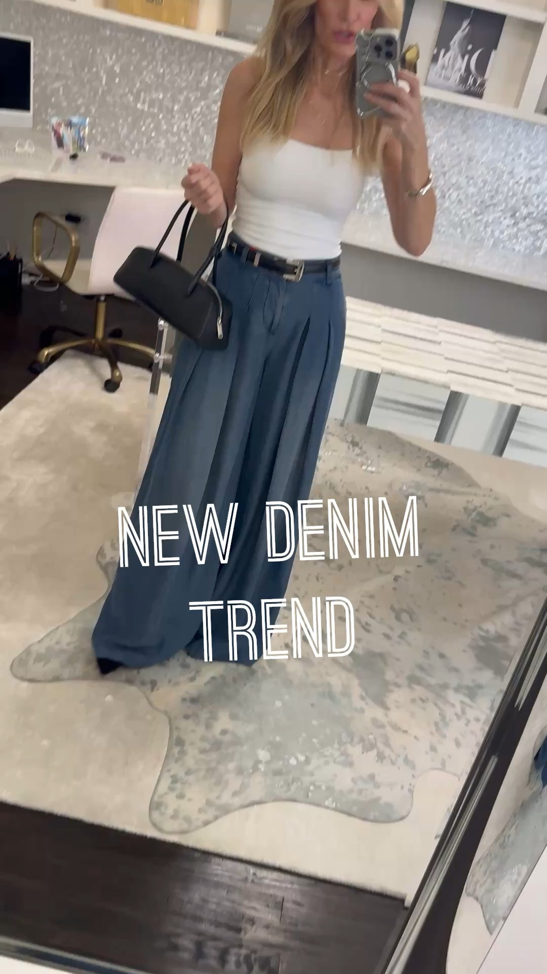 Are your jeans aging your style? Try this denim trend instead. ✨

These wide-leg denim trouser jeans by Alice + Olivia are everything. They’re lightweight, incredibly comfortable, and the high-waisted, wide-leg silhouette is so flattering.

For summer, I paired them with this chic white halter top from Aritzia for an effortless, elevated look. Then when fall arrives, just throw on a black leather jacket and you’ve got an outfit that feels modern, polished, and put together.

Bonus: they have pockets (always a win 🙌) and they’re super comfortable too.

Fit details: Wearing a size 24 in the jeans and an XS in the top. Both run true to size.

Would you wear denim trousers? Let me know in the comments!

#LTKootd #LTKgrwm #LTKOver40
