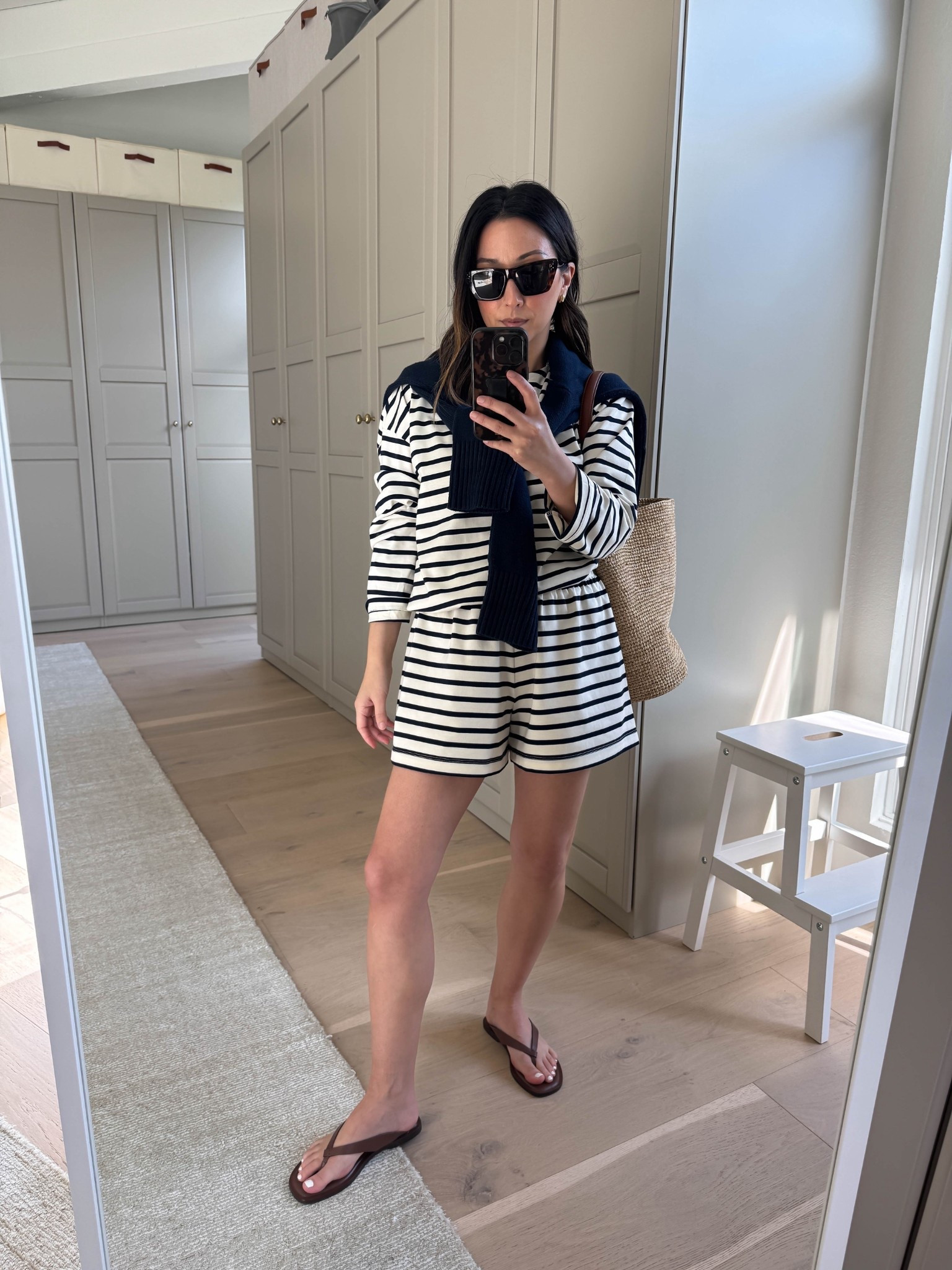 Spring Tops to Rotate: Stripe Tees. Be picky! The wrong stripe tees can cheapen your outfits. 

Tuckernuck stripe tee xs -  runs roomy
Tuckernuck shorts small
Everlane flip flops 5
J.crew bucket bag
Everlane cotton sweater xs
Celine sunglasses 
Dorsey James necklace 15”
Quince earrings  

Spring outfits 2026, spring style, petite style 

#LTKPetite #LTKSeasonal #LTKootd