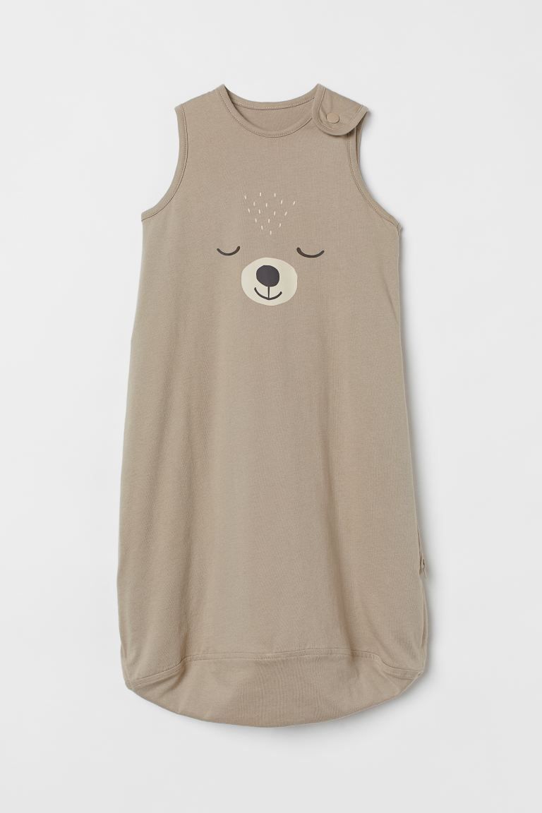 Conscious choice  Padded sleep bag in soft cotton jersey with a printed pattern. Snap fastener on... | H&M (US + CA)