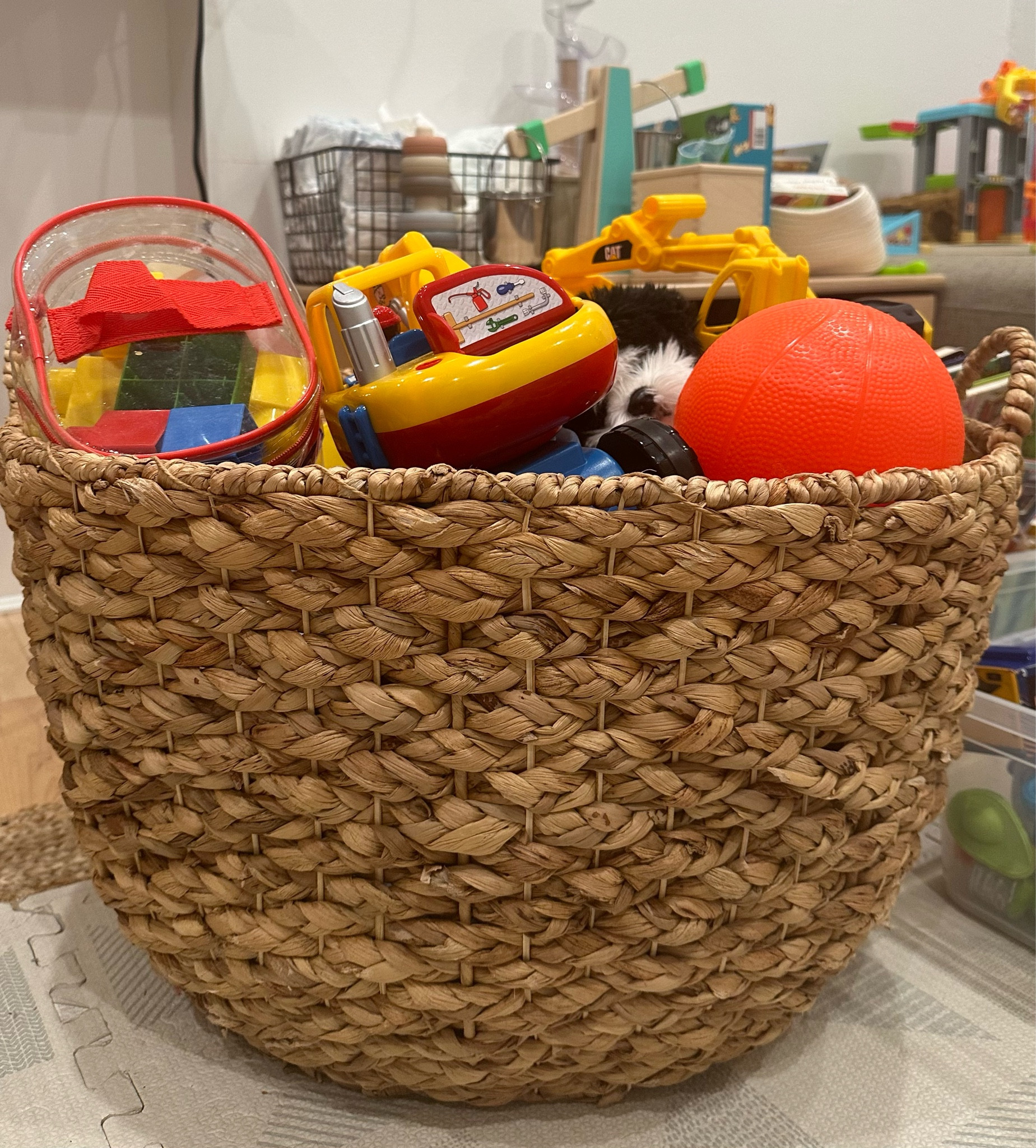 Have started storing my toddler’s toys in these straw baskets and it *sparks joy.* So much more elevated than the plastic bins we had been using. #parenting #toyrokm #playroom #toddler #organization #storage 

#LTKbaby #LTKhome #LTKkids