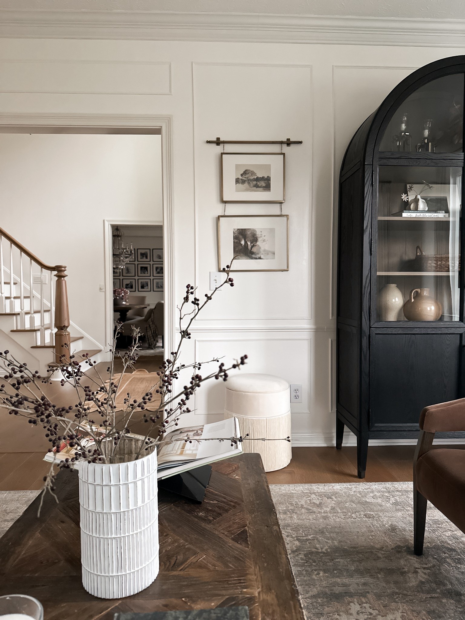 Living room details 🤍

Picture frames, magnolia, arched cabinet 

#LTKHome