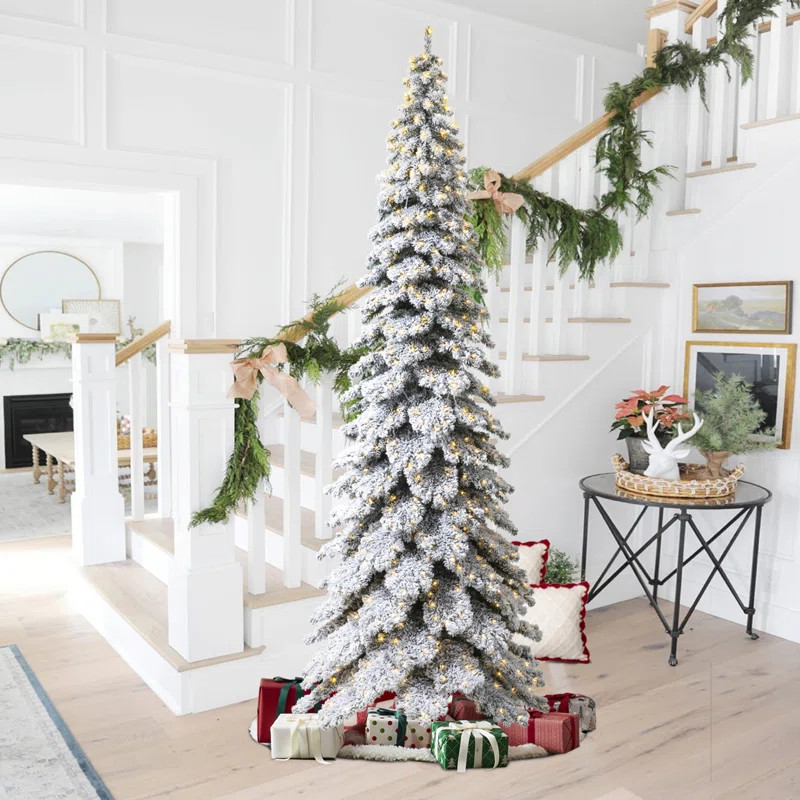 The Holiday Aisle® 12' Pre-Lit Flocked Layered Slim Spruce Artificial Christmas Tree with 900 Li... | Wayfair North America