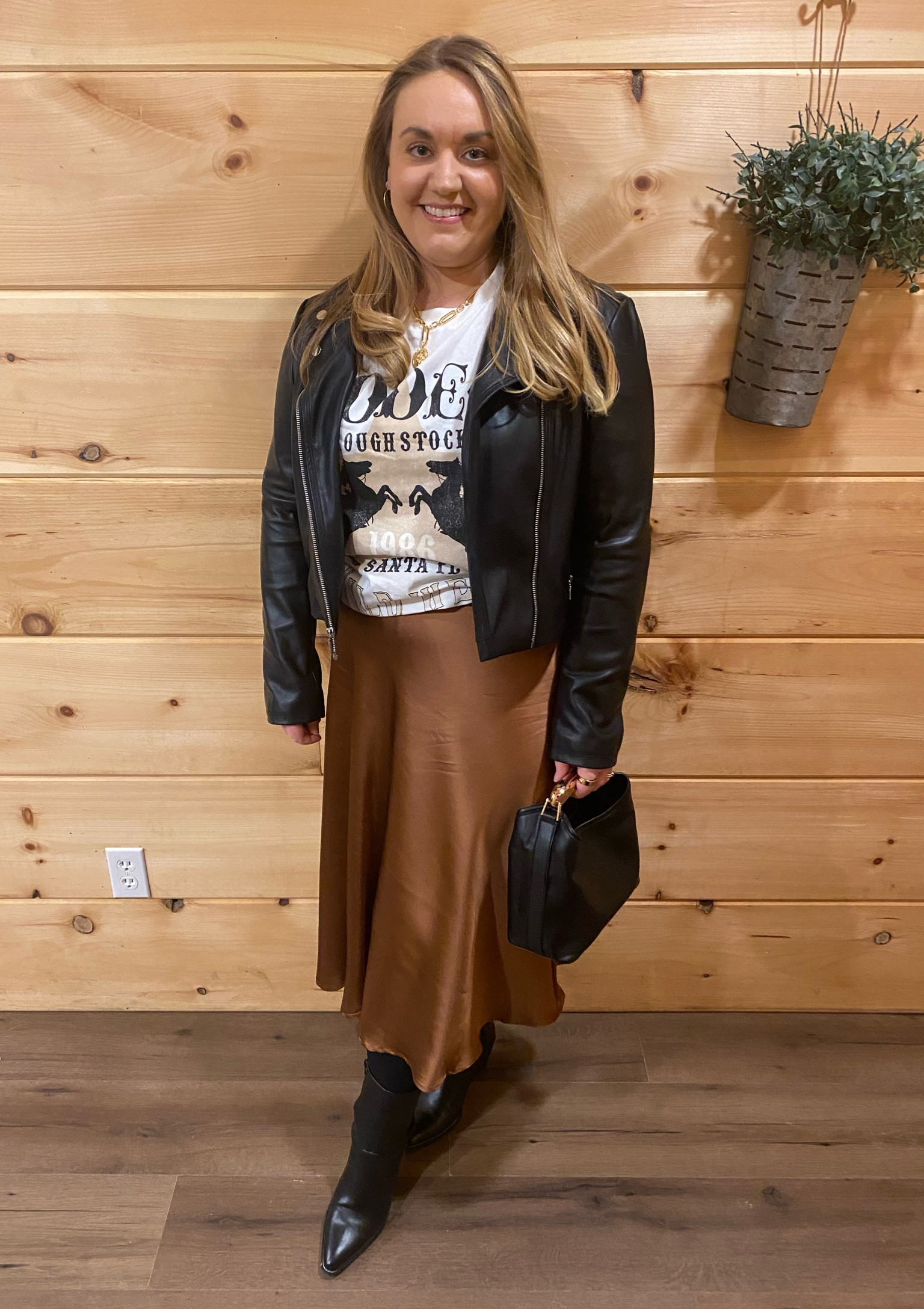 Country western, Nashville, rodeo, oversized tee, leather jacket, pointed toe boots, western boots, black pointed toe boots, black handbag, black bag, Tennessee, broadway outfit

#LTKMidsize #LTKItBag #LTKTravel