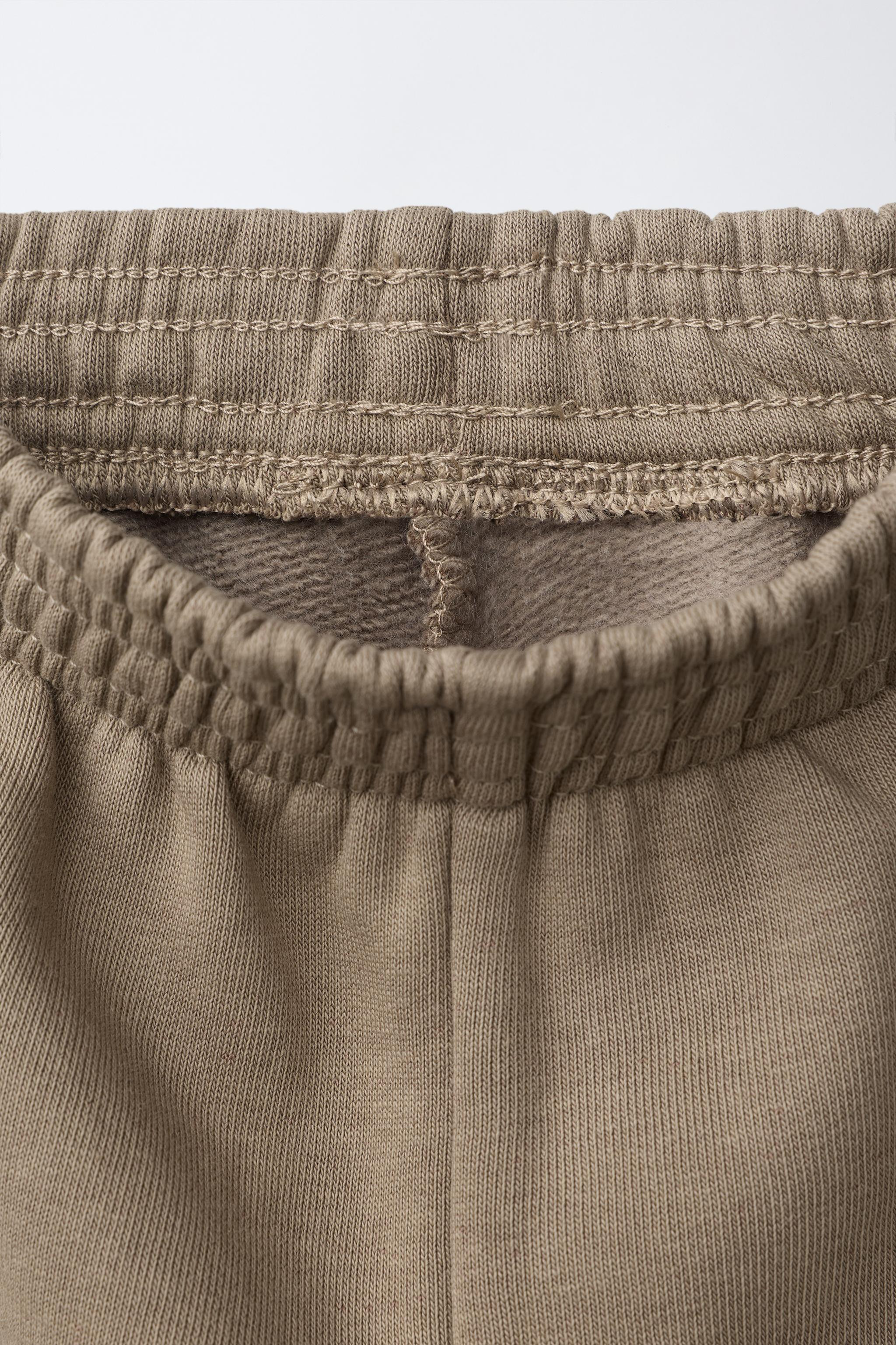 Pants with an elastic waistband. Front pockets. Front label appliqu\u00e9. Elastic hem. Soft, war... | Zara US
