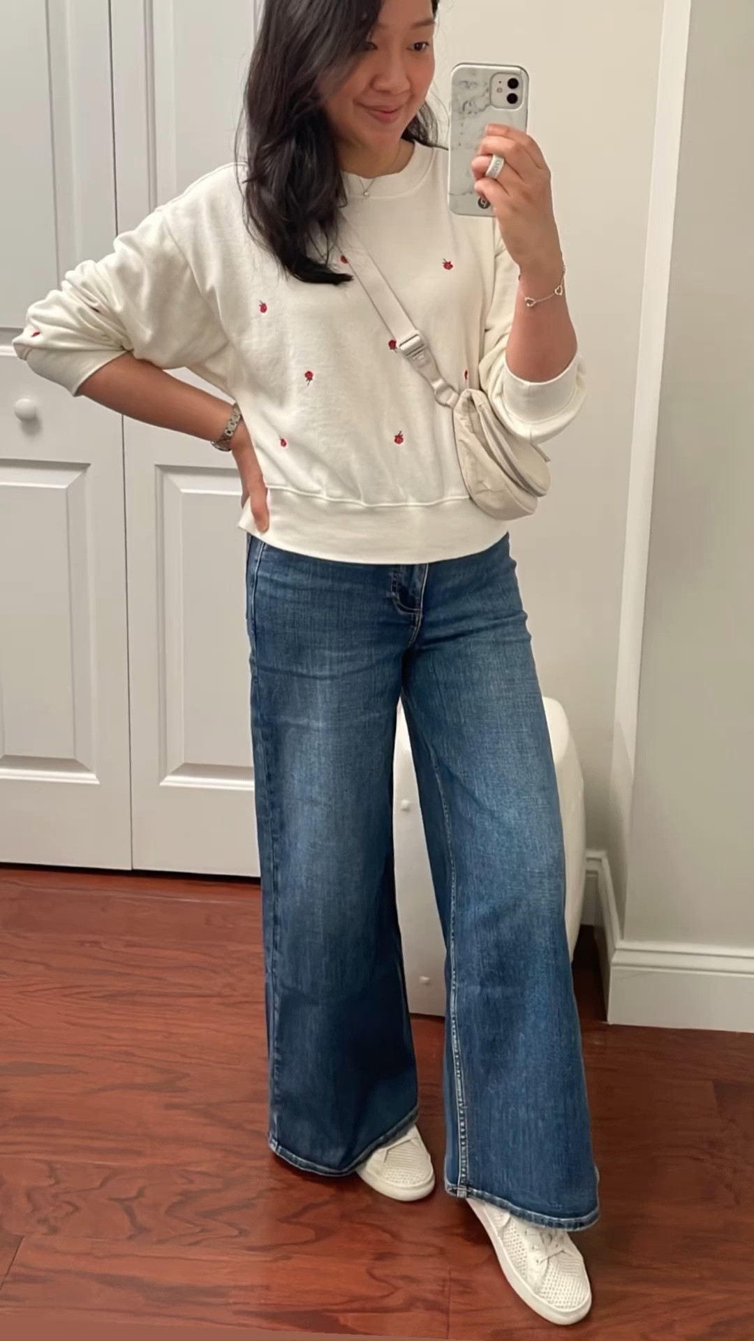 $79.99 Rag & Bone high waisted cropped wide leg jeans in size 26 which are full length on me since I'm petite. I'm 5' 2.5" and currently 115 pounds.

Rose embossed sweatshirt in small petite for an oversized fit.

#LTKOver40 #LTKFindsUnder100