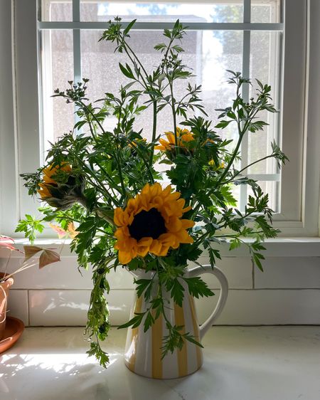 Sunflowers & cut parsley from my garden in a yellow striped pitcher from Amazon ☀️🌻😎