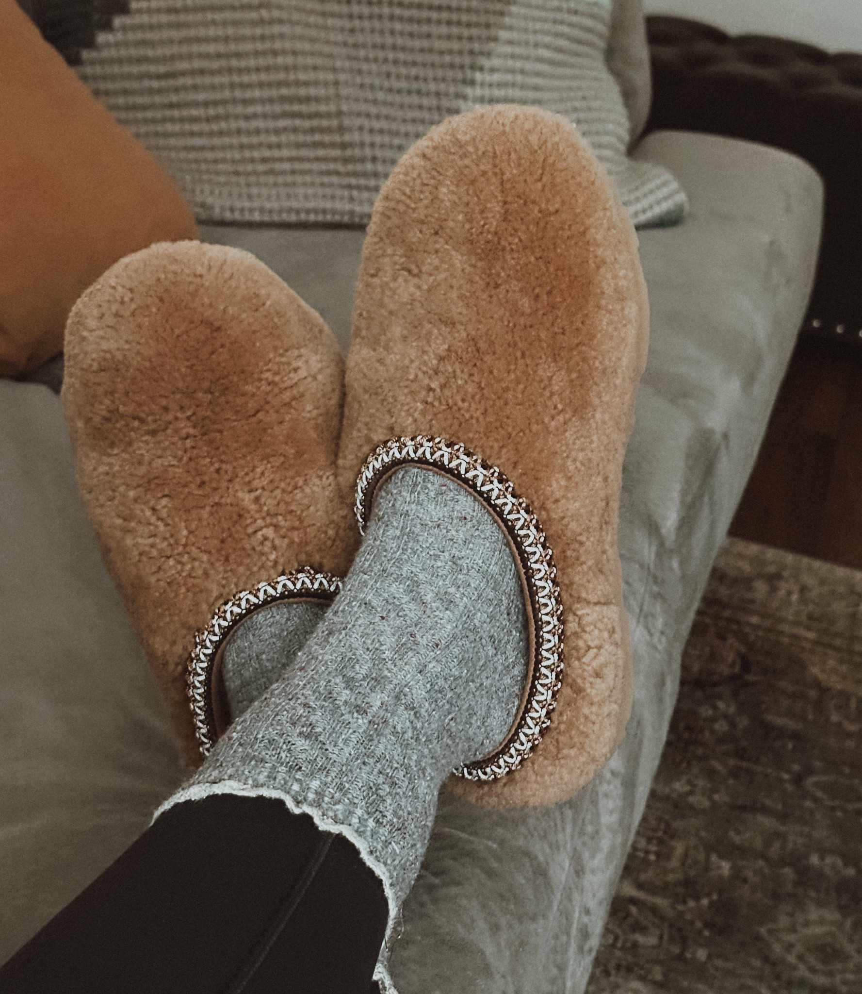 Found the coziest fuzzy UGG slippers… in the kids section 🙌

I usually wear a women’s 6.5 and the kid's size 5 fits perfectly — plus they’re way more affordable. Same soft shearling feel, same classic look, just a smarter buy.

#LTKPetite