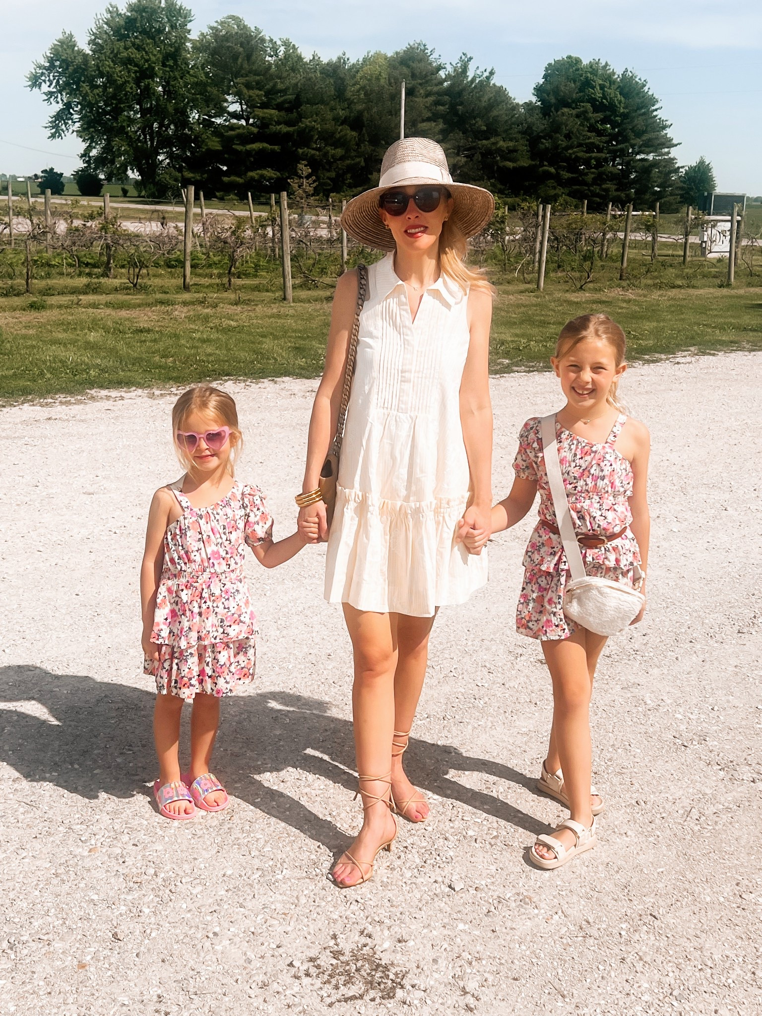 Prettiest summer dress! It’s much more striking in person than it photographs. It’s yellow. Love the perfect ladylike length for a short dress. 
It’s Lilly Pulitzer and has sea shell details. Fave summer hat for a winery day too! 
I’m wearing the XS. It also comes in pink! 