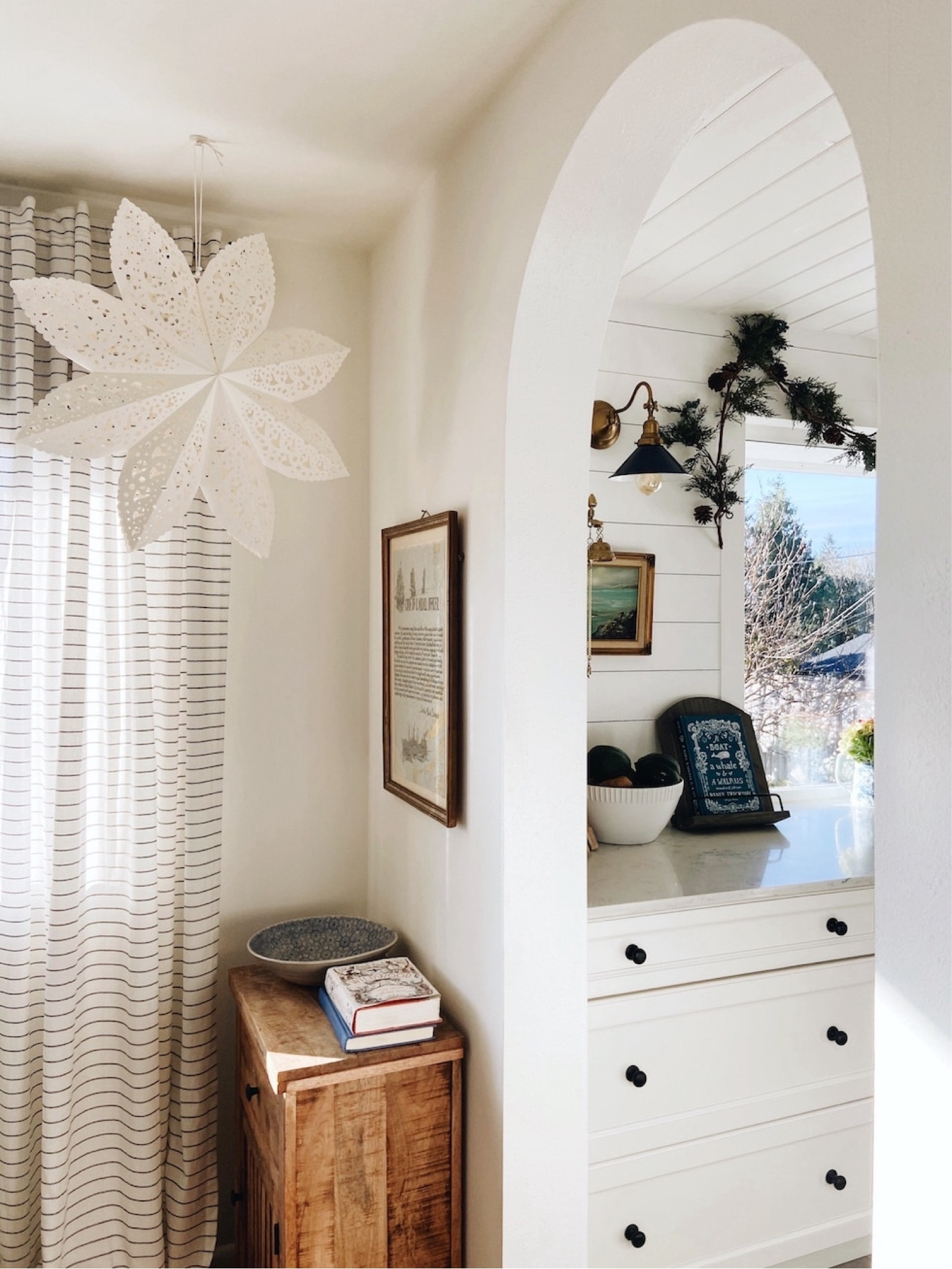 Hanging snowflakes, black and white striped curtains, and kitchen sources

#LTKSeasonal #LTKhome #LTKHoliday