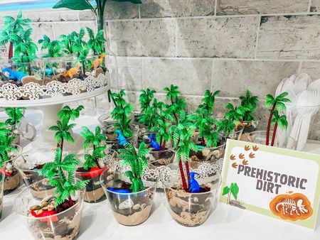 Dino themed birthday party cute dessert option - “prehistoric dirt”. I got the trees, dinosaurs, cups, and chocorocks on Amazon and it fit the theme perfectly!! 

Three-Rex. Boy birthday inspo. Kid dinosaur themed birthday party. Third birthday. Toddler birthday party. 

#dinosaurparty #boybirthdayparty #kidsparty #dinoparty

#LTKparties #LTKkids #LTKhome