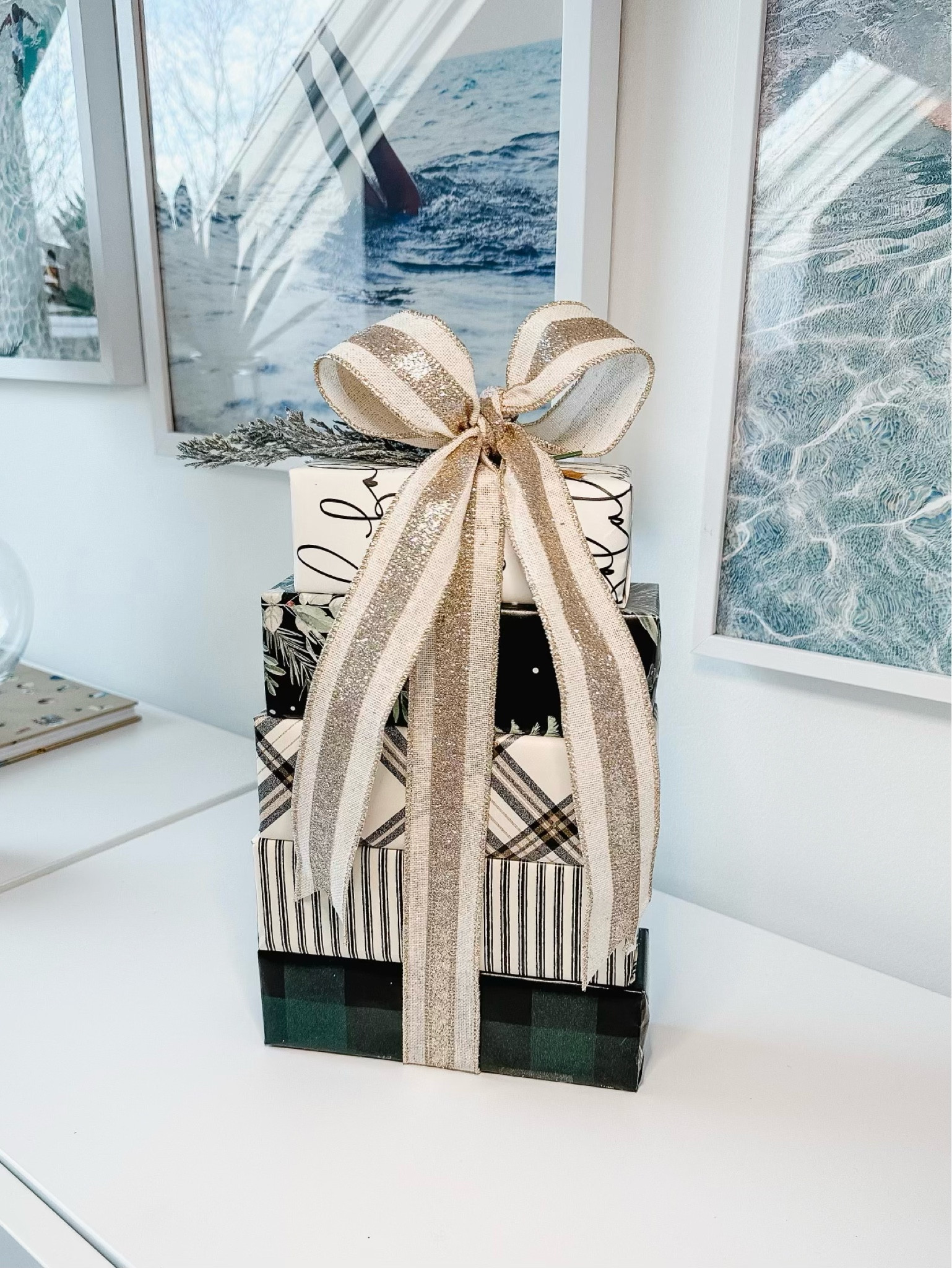 Day 8 of our wrapping series - coordinating wrapping paper and tying the perfect bow! I’m sure there are other ways to tie bows, but I do it this way and adjust the ribbon as I’m tying. Wired ribbon makes it really easy to shape the bow! Also - I love how these papers all coordinate together - mixing black, green, ivory, and gold in a variety of papers makes it cohesive and interesting! This would all look great with just one paper, but just wanted to show you some ideas! 

#LTKHoliday