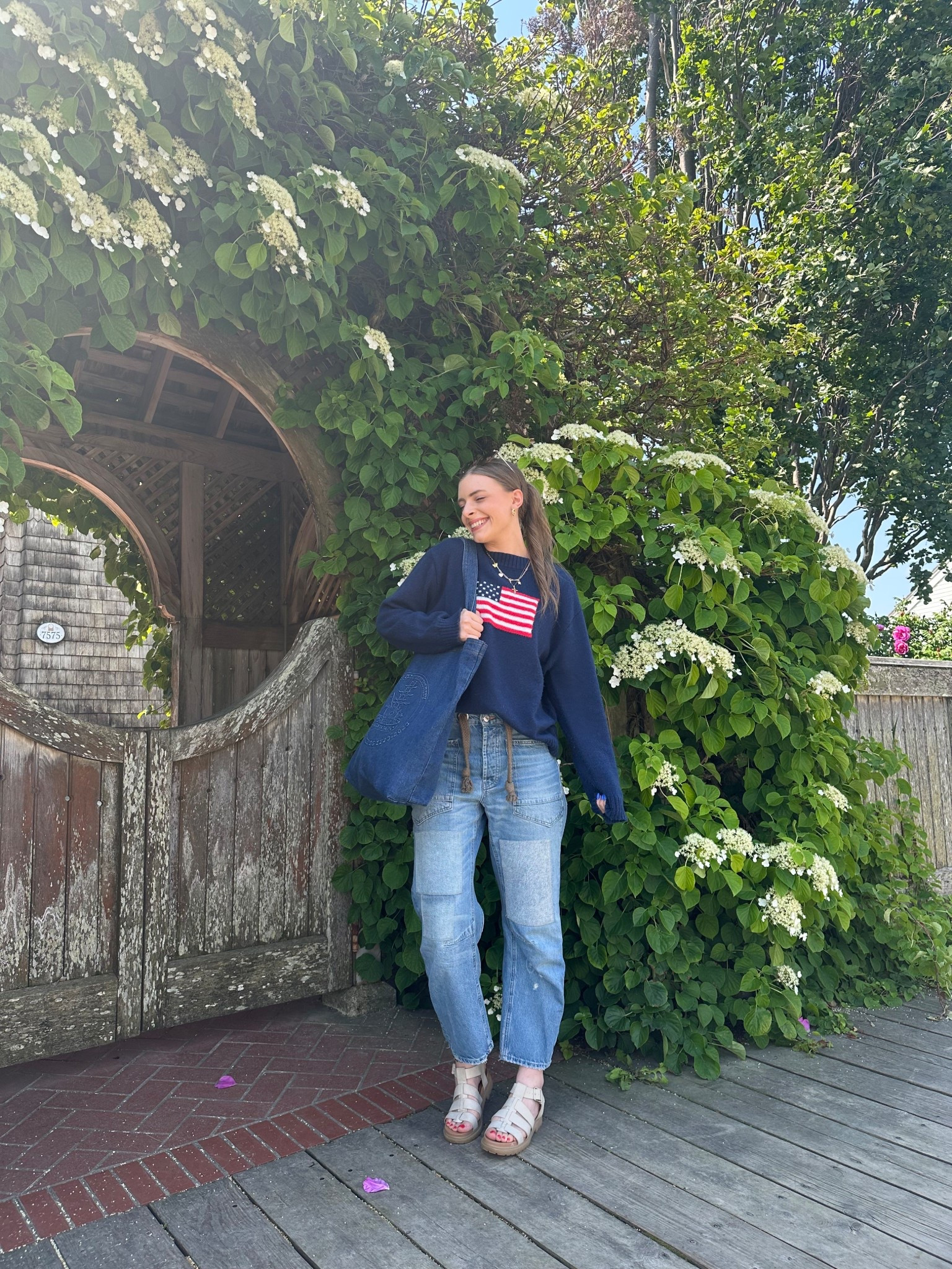 4th of July outfit!!

Patriotic Americans summer outfit style, Pinterest girl Americana aesthetic, flag sweater USA American United States, navy blue sweater with large flag knit, oversize summer sweater, free people we the free moxie railroad low slung barrel leg jean, tillys soda fisherman sandals, denim tote bag oversized, gold accessories 