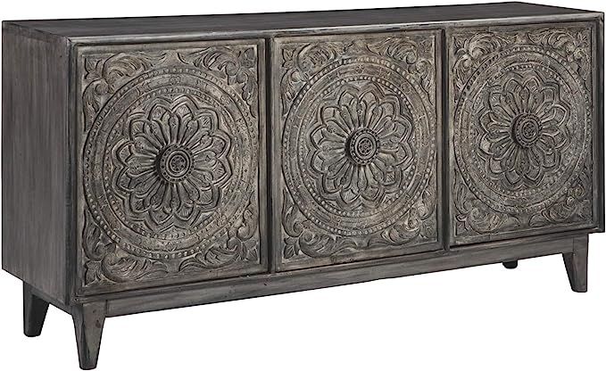 Signature Design by Ashley Fair Ridge Boho Hand Carved Wood Accent Cabinet or TV Stand, Dark Gray | Amazon (US)
