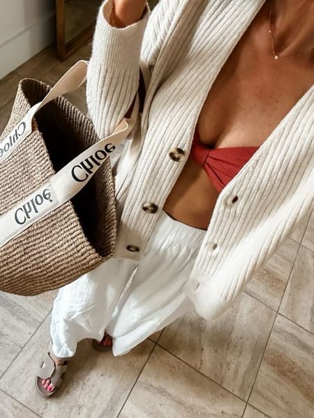 This Chloé bag is my favorite tote for the beach. Pair it with your favorite swimsuit, linen blend pants, and cardigan for a breezy beach day. 

Lovely Grey, beach outfit idea 

#LTKSeasonal #LTKswim #LTKstyletip