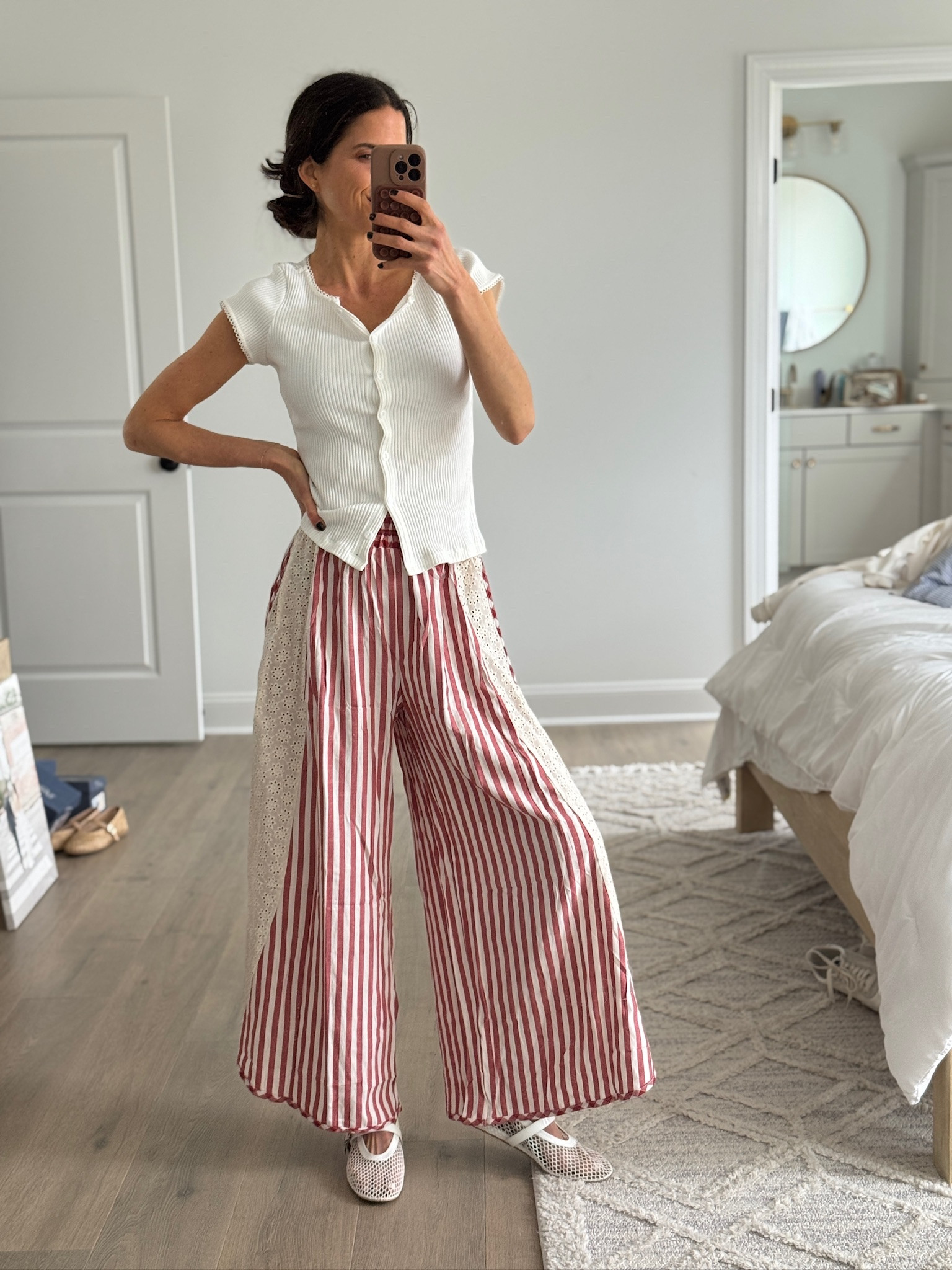 Spring wide leg pants outfit. Red striped palazzo pants, white ribbed button top, breathable flats. Casual spring outfit, lightweight flowy pants, feminine everyday style.


#LTKSeasonal #LTKootd #LTKmomlife