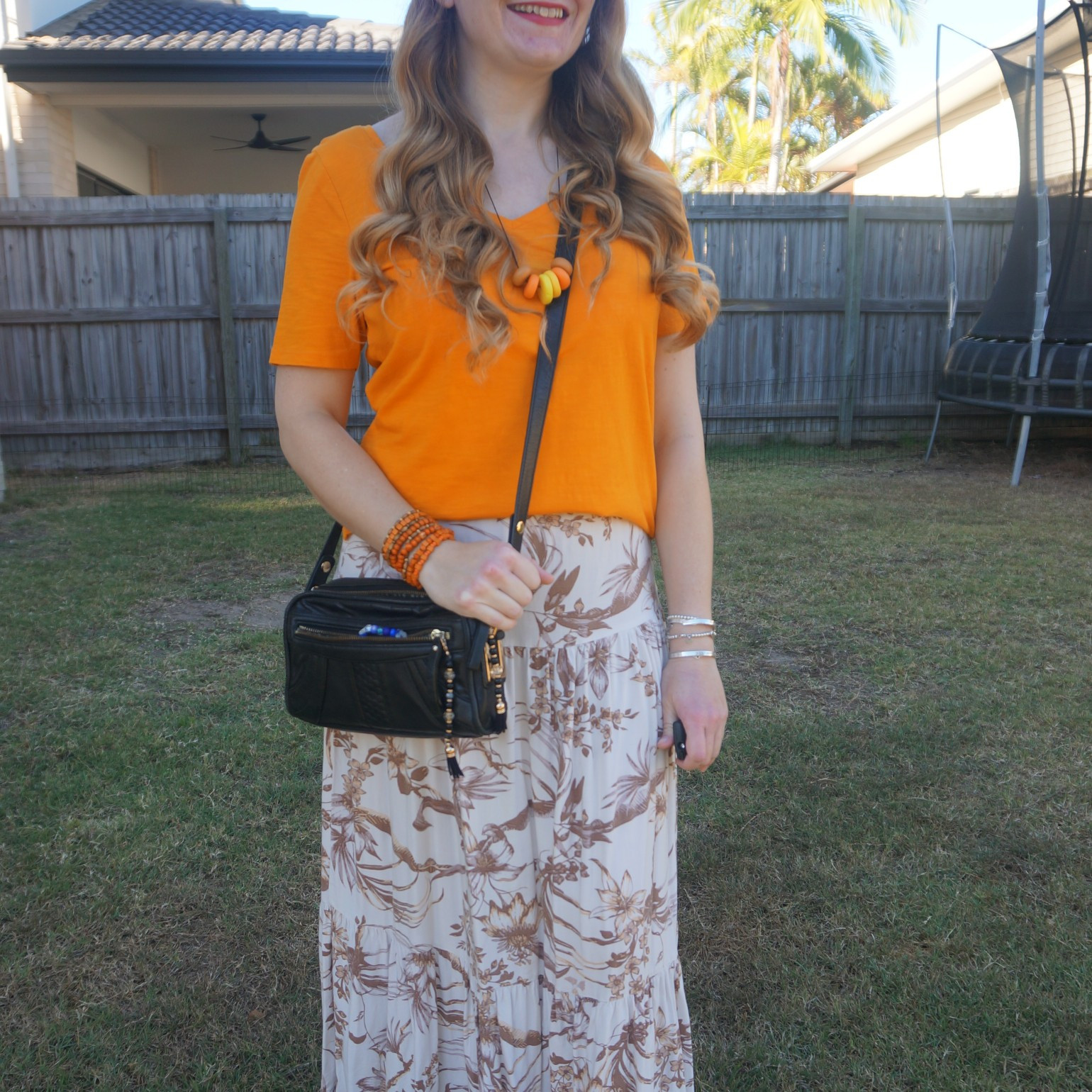 Orange tee with brown floral midi skirt and recently thrifted Mimco patchwork crossbody bag 🧡🤎

#LTKaustralia #LTKbag #LTKspring