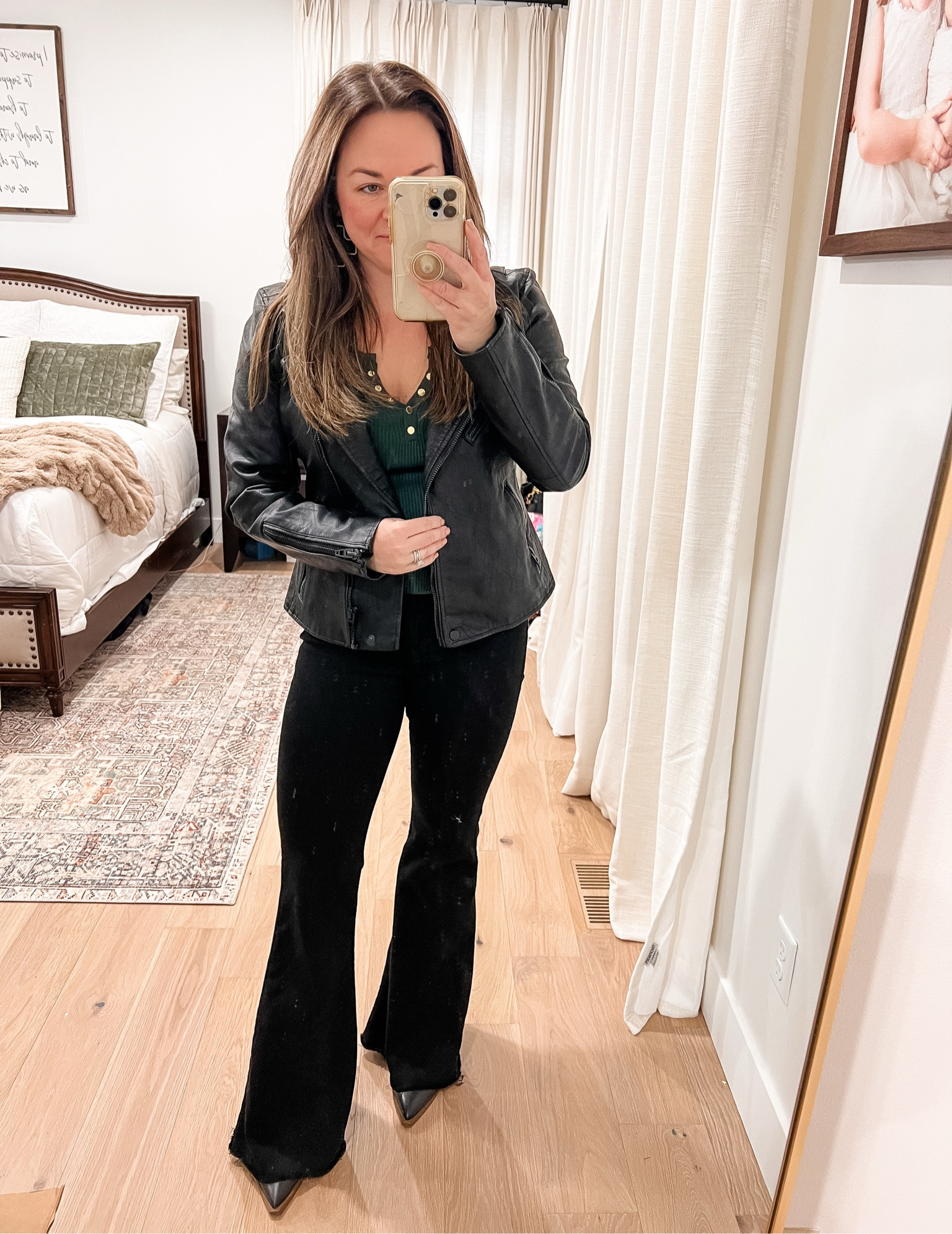 Blanknyc moto jacket in onyx with all black detail. I’m wearing a medium. It is very fitted and tailored fit. 