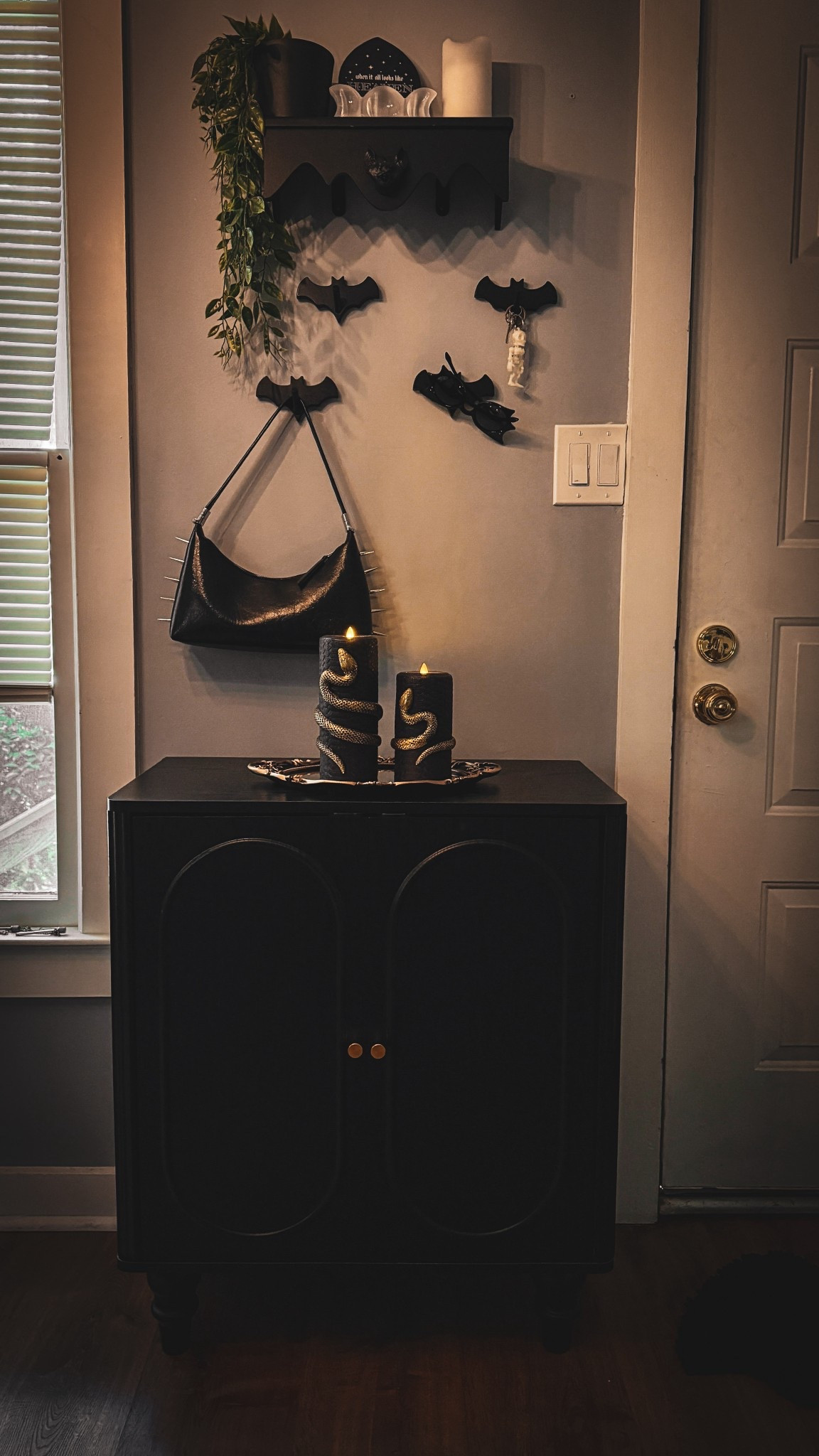 Little entryway refresh this this new storage cabinet 🖤🦇

#LTKHome