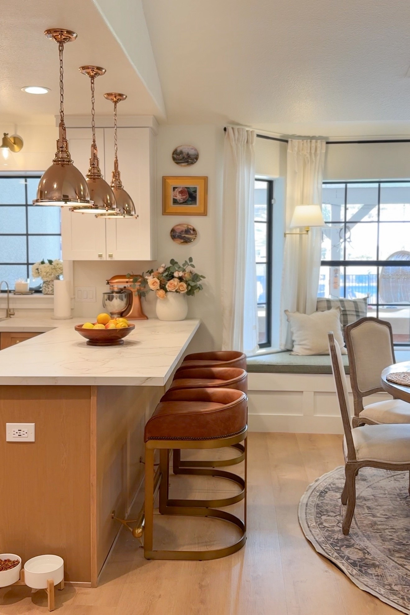 Warm wood cabinets, copper lighting, and collected vintage touches make my kitchen renovation feel like home 

#LTKHome #LTKSaleAlert #LTKSeasonal