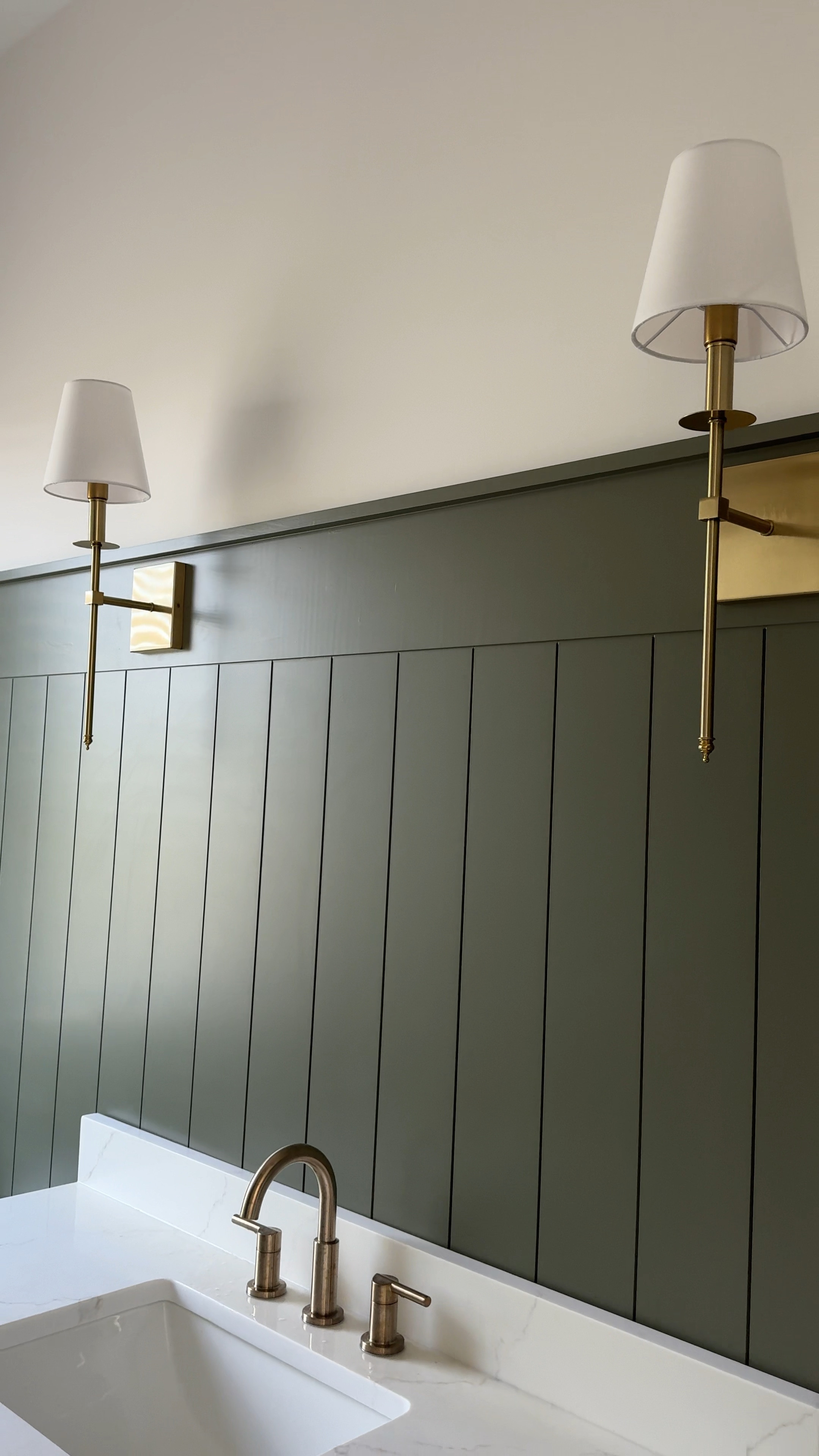Loving the contrast of these wall sconces against the board and batten wall! The brass accents bring warmth and complement the deep green beautifully. It’s all about those little details that make a space feel complete.

#LTKVideo #LTKFindsUnder100 #LTKHome