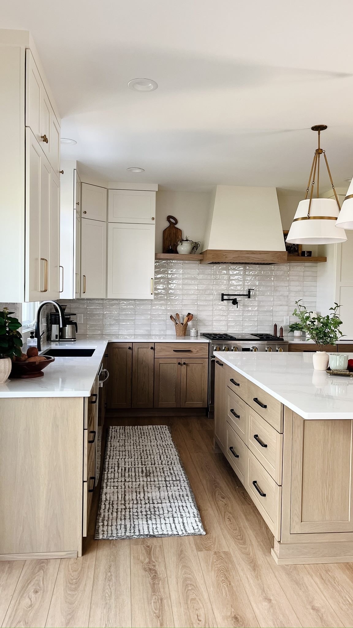 ✨Before & After✨

It’s hard to imagine the old kitchen after working in this remodel for some time now. By bumping out the fridge wall, we gained enough space to add an island with seating along with a beverage bar that connects the kitchen and dining spaces together. Builder Credits: @trubuiltbuilders 

Here are a few things I love about the changes made to this space:

1) Functional Cabinetry: All the cabinets were designed with functionality in mind. From the appliance garage to the hidden island cabinetry, there’s a space for every kitchen gadget. Come back later this week and check out the customized cabinets as I share more about this remodel! Cabinetry by @trucraftcabinetry

2) Decorative Lighting: The island lights definitely add a nice element to this kitchen. Be on the lookout this week as I’ll be sharing some spend or splurge island lighting options to elevate your kitchen! 

3) The Open Shelves: The little twin shelves hugging the hood create a nice little space to display nice some decor, your nice cutting boards, some decorative pottery, etc. 

What changes would you make to your kitchen to make it more functional for your home? Let me know in the comments!