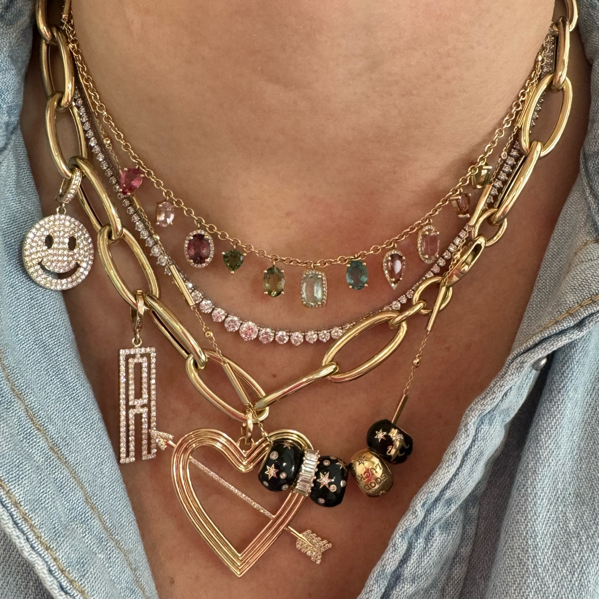 These jewels will put a smile on your face! I can’t help but load up this gorgeous gold chain with diamond studded charms! And, I almost never leave home without my lucky bead party necklace on! This look is just perfection! Especially with that mixed tourmaline dangle necklace! #mixedtourmaline #danglenecklace #shakernecklace #BeachParty #Chains #TennisNecklace #HeartJewelry #LuckyBeads #LuckyGirl #InitialJewelry #InitialCharm #smileycharm #smileyCharm

#LTKCyberWeek #LTKGiftGuide #LTKHolidaySale