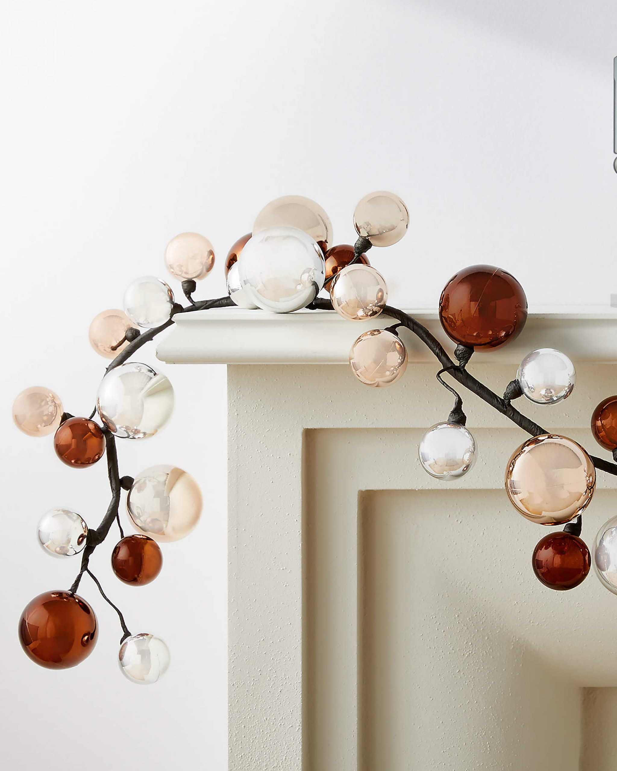 Add a touch of elegance to your holiday decor with this festive, Metallic Holiday Garland. Featuring handmade champagne gold, silver, and bronze-colored balls, it casts a subtle, sophisticated shine that enhances any setting.

Drape it over a mantel, wrap it around a staircase, embellish a pine garland, or use it as a sparkling centerpiece for your holiday gatherings. With its timeless metallic tones and endless styling possibilities, this garland is perfect for creating a warm and glamorous festive atmosphere.

#LTKHome #LTKHoliday #LTKSeasonal