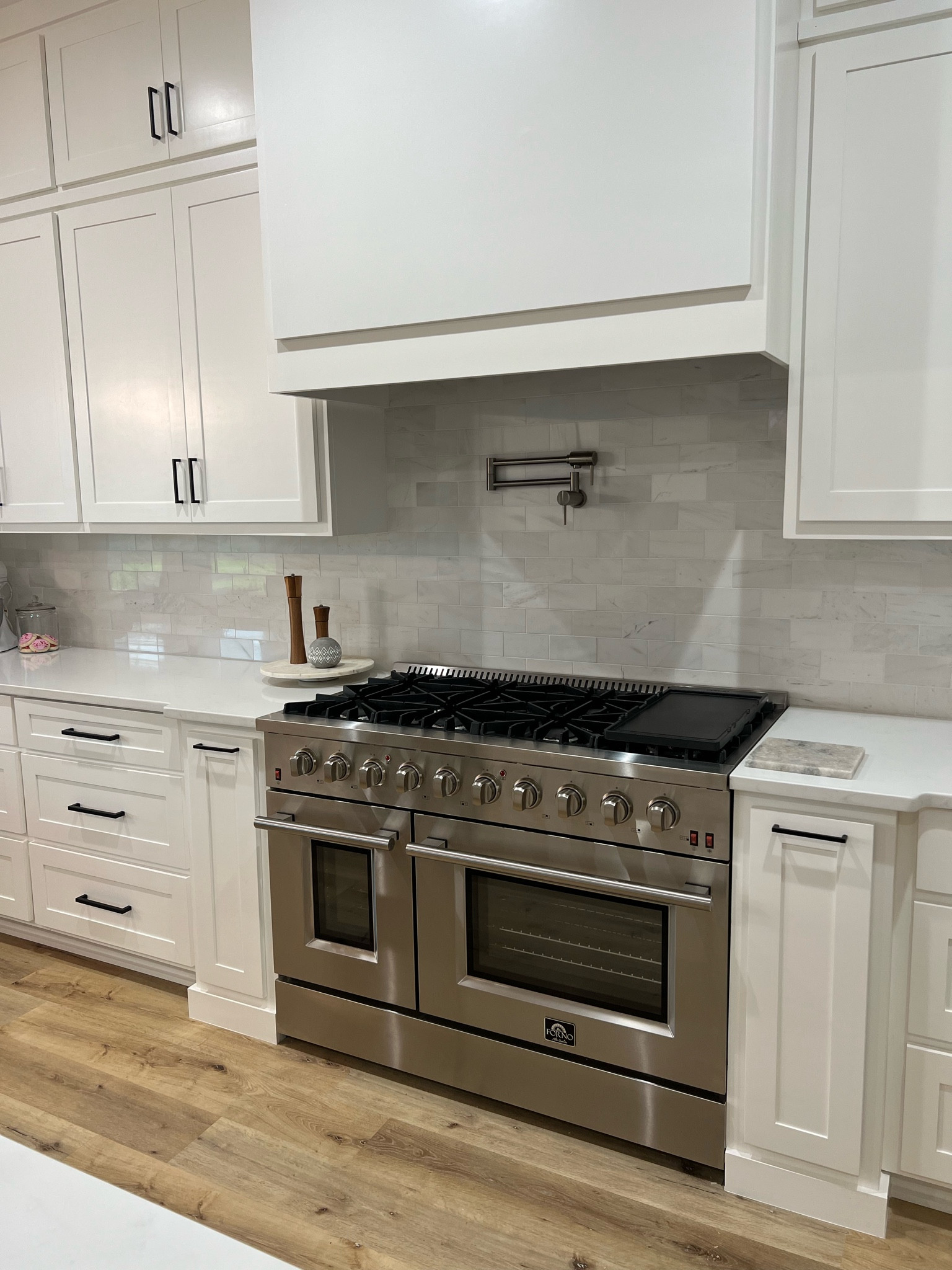 Again same deal with the fridge- wanted the expensive wolf gas range stove look but for less! So far we love it! Linking the pot filler and backsplash too! Pot fillers are so inexpensive to add to your build but serious game changer. 

#LTKhome #LTKFind