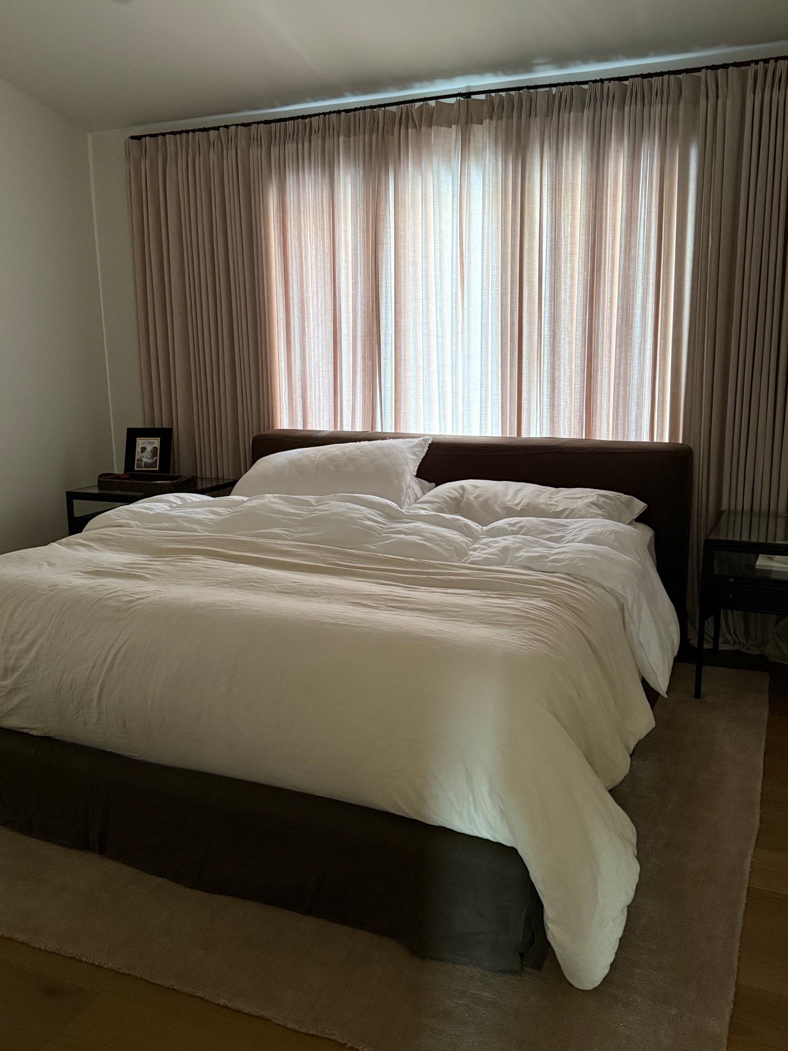 Primary bedroom, pinch pleat curtains, linen bed, drapery, curtains, bedroom furniture 