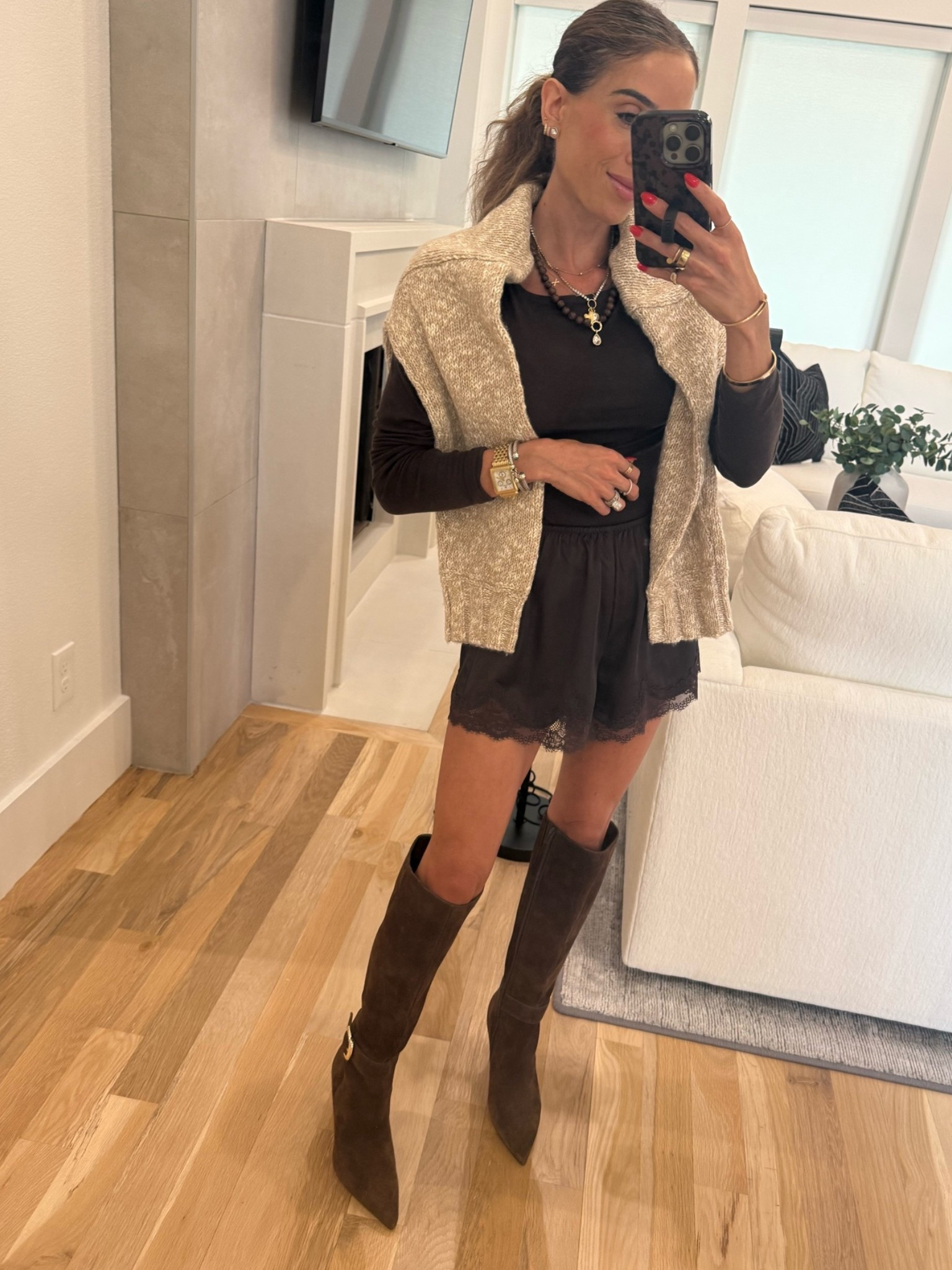 Easy fall outfit idea that looks put together! Trending satin shorts with brown long sleeve and neutral cardigan wearing xxs