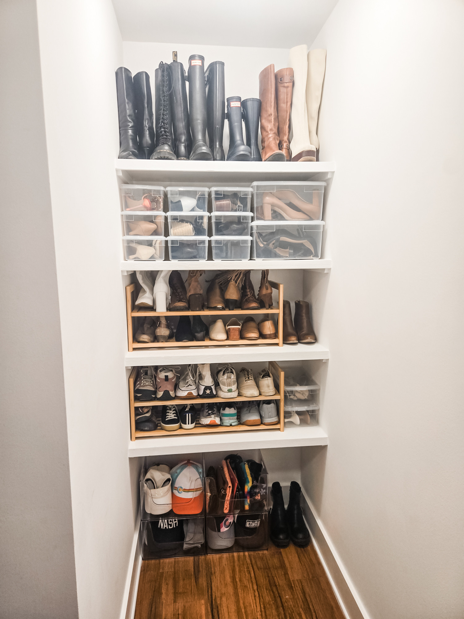 The perfect overflow closet! Living in a rental means being creative with storage - we don't want to invest a ton in infrastructure and also want to use organizing products that can be repurposed down the line. Creating this spot to act as an extra closet storage for shoes and hats means that the main closet has some room to breathe. 

 