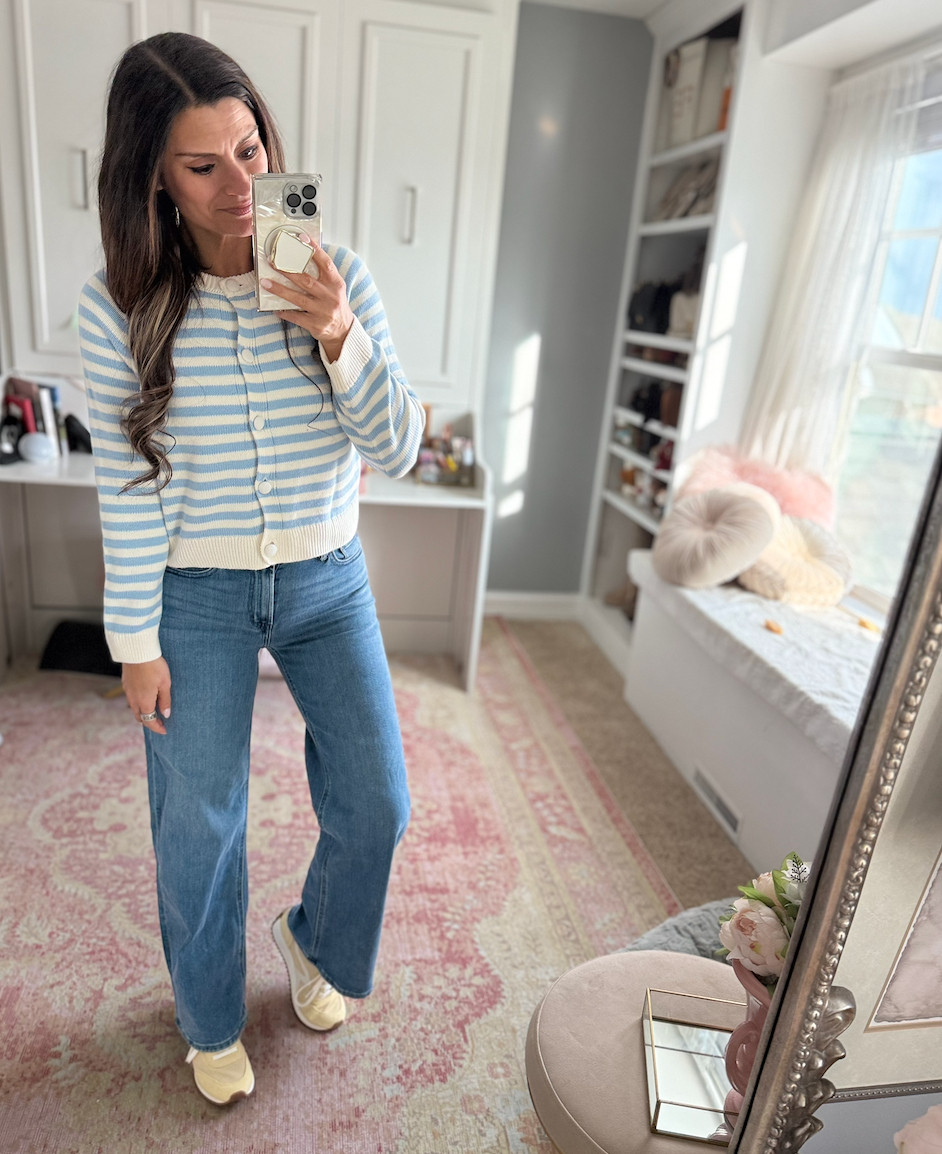 Spring outfit idea with a blue striped cardigan, jeans, and yellow sneakers 

 