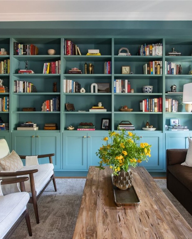 After nearly 10 years in their DC row home, our clients knew exactly what they loved about their house, and exactly what wasn’t working anymore.

Rather than starting over, they wanted to make each room feel more intentional, more functional, and better suited to the way they live today.

We kicked things off in the front living room, transforming it into a space designed for quiet mornings, good books, and gathering with friends. A rich teal paint color gave the room its own identity, while a simple update to the existing built-ins, adding cabinet doors to the lower half, created hidden storage and instantly made them feel more custom.

We finished the shelves with a thoughtful mix of books, collected treasures, and family photos, creating a space that feels personal, layered, and lived in.

#historichomes #dchomes #marylandinteriordesigner
