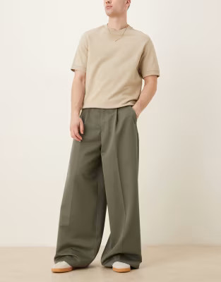 ASOS DESIGN extreme wide leg dress pants with front pleats in green | ASOS (Global)