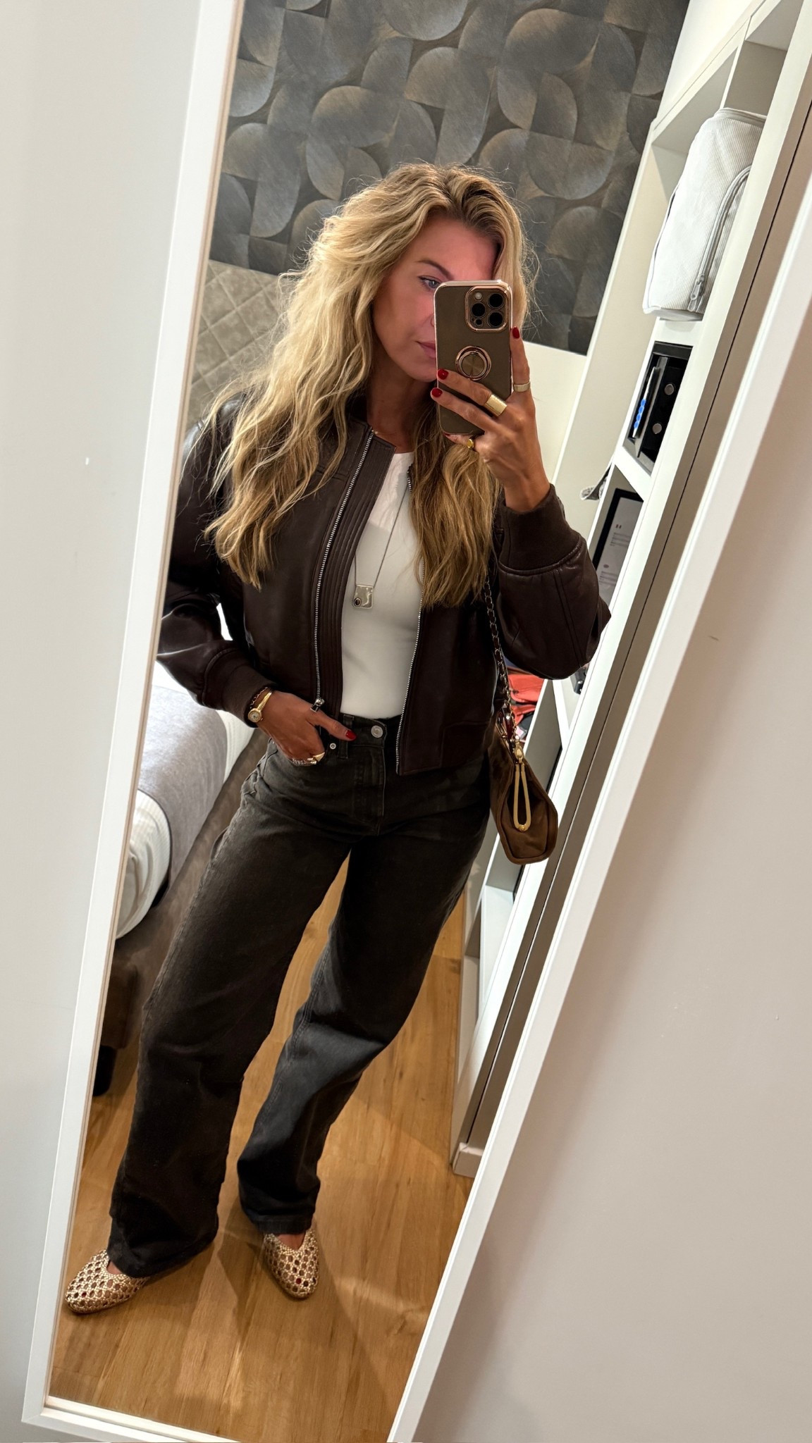 Outfit for the Milan soccer game and our first day in the city.
Leather Bomber jacket: runs TTS, wearing a S (size up if you want an oversized fit, I didn’t). I linked some similar leather bombers and different price points as well!
White fitted tank top: Runs TTS, wearing a S
Brown high rise wide leg denim: runs TTS, wearing a US 2 (has a good amount of stretch to them and they hold their shape - oh my gosh I can’t recommend these enough)
Gold woven flats: Run TTS (they stretched out a little bit on me, but not enough to order down)
Ray ban sunglasses + long silver and tortoise pendant necklace 

#LTKSeasonal #LTKStyleTip #LTKBeauty