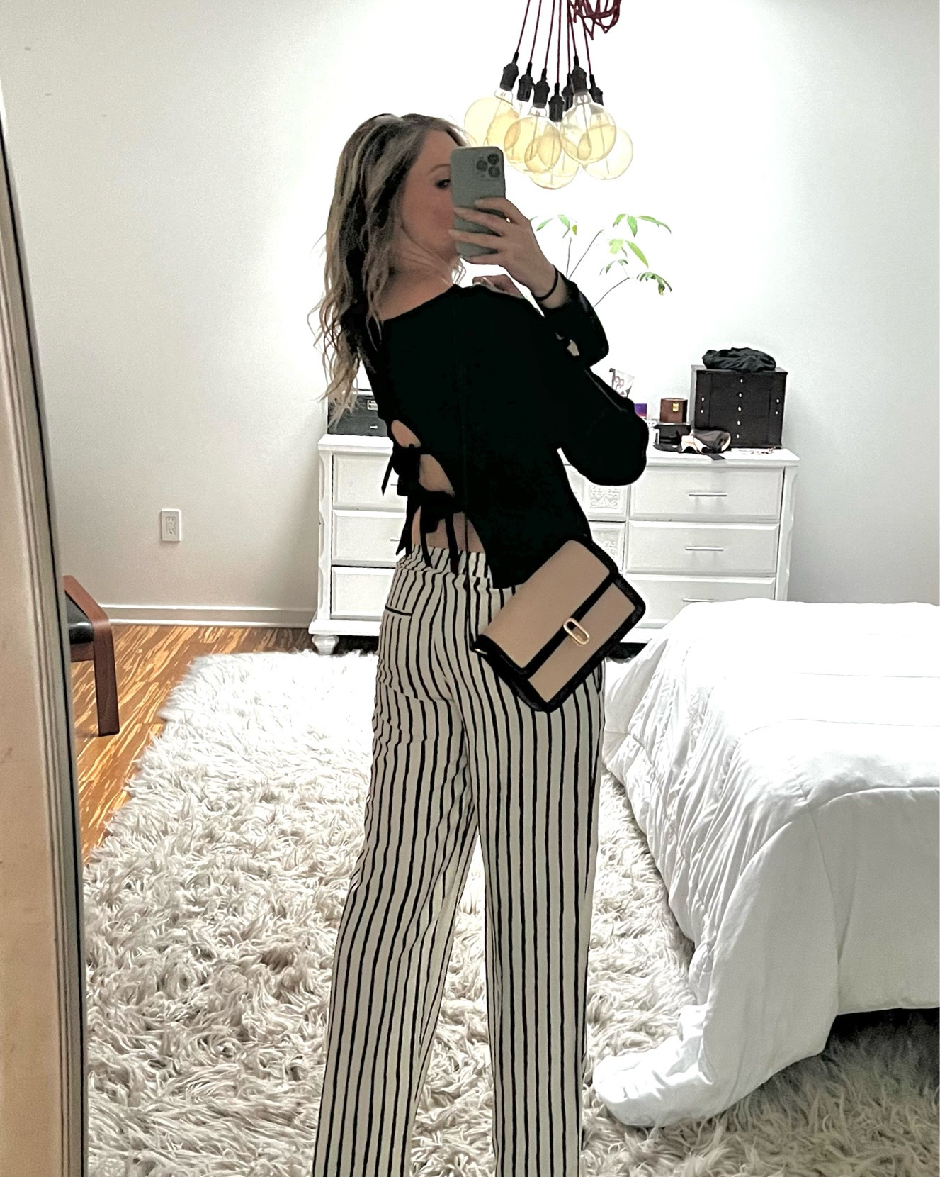 Date night outfit inspiration 🖤🤍
Found the sweater and pants at different boutiques while traveling, so I linked similar products. The bag is from my FabFitFun fall 2025 box. Pair with a cute black heel or pump and you will be date ready. 

#datenight #LTKdatenight