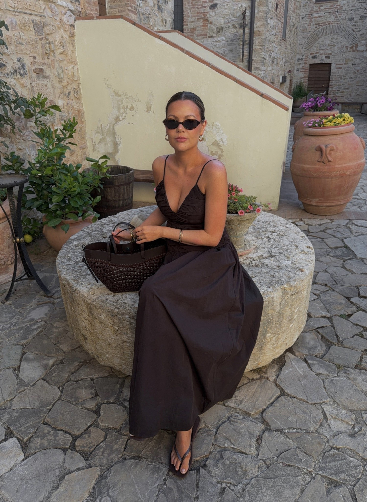 Dark chocolate brown maxi dress, ruched bodice, sweetheart neckline, delicate spaghetti straps, fitted waist, voluminous A-line skirt, cotton-poplin look, minimalist elegance, timeless silhouette, feminine and romantic, Mediterranean summer aesthetic, effortless luxury, understated chic, resort wear, neutral monochrome styling, sophisticated evening-to-day dress, soft draping, classic and refined, brown summer dress, Dissh, Dissh dress

#LTKuk #LTKsummer #LTKstyletip