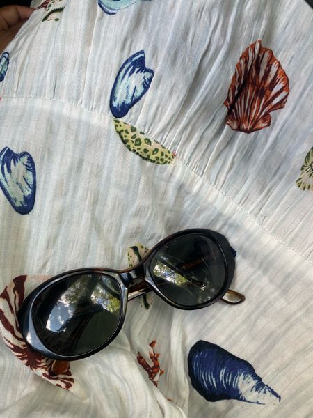 Sunny day essentials for the beach. Seashells and sunglasses 
The dress has light blue textured stripes like the ocean  

#LTKSeasonal #LTKStyleTip #LTKFindsUnder100