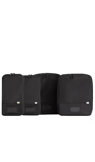 The Compression Packing Cubes 4pc in Black | Revolve Clothing (Global)