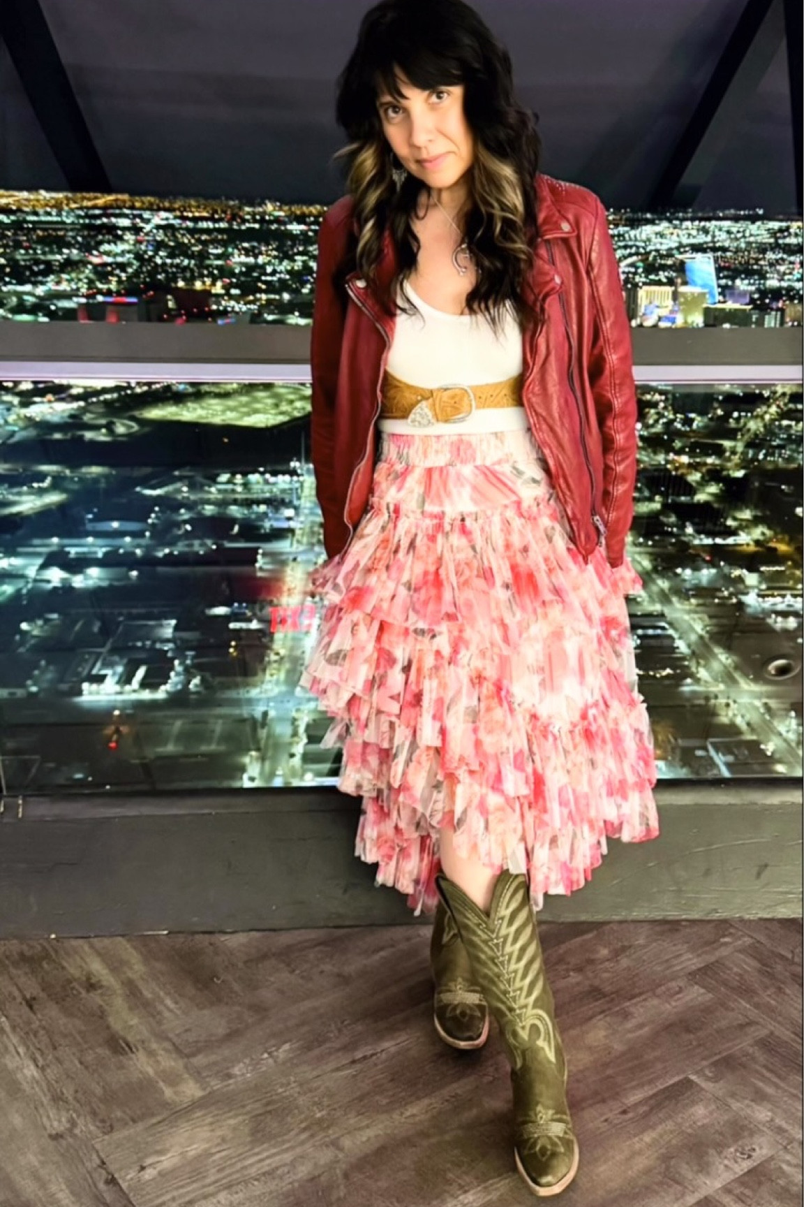 🎀 NFR Outfit #7: Pink Party at The Strat 🎀
360° views, everything pink, and a look with heart—supporting breast cancer awareness in style! 🌸 Rocking a tiered Rose skirt by @rodeoquincy, paired with olive suede squash blossom boots by @lane.official . Leather and frills are sweet but add a harness by @westerlyusa the outfit goes from nice to spicy nice.

Serving up glammed-up girl-next-door vibes, all while celebrating strength and community. 💖

Skirt S | Jacket S |.  Boots 7 | Bodysuit S

#NFRStyle #PinkParty #BreastCancerAwareness #WesternFashion #RodeoQuincy #LaneBoots #WesterlyUSA #RodeoRose #GlamCowgirl #VegasStyle #RodeoReady #NFROutfitInspo #fyp

#LTKParties #LTKOver40 #LTKHoliday