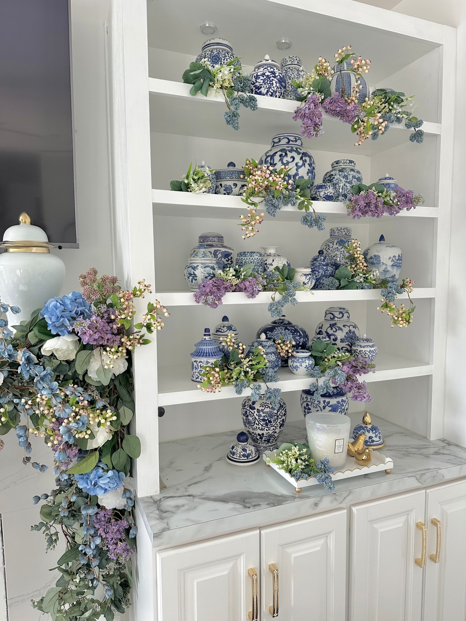 Re-create this look by adding some stunning lilacs, pink and cream crab apple berry stems and blue pom-pom florals! So charming on your shelving or mantle for Spring!

#LTKSeasonal #LTKHome