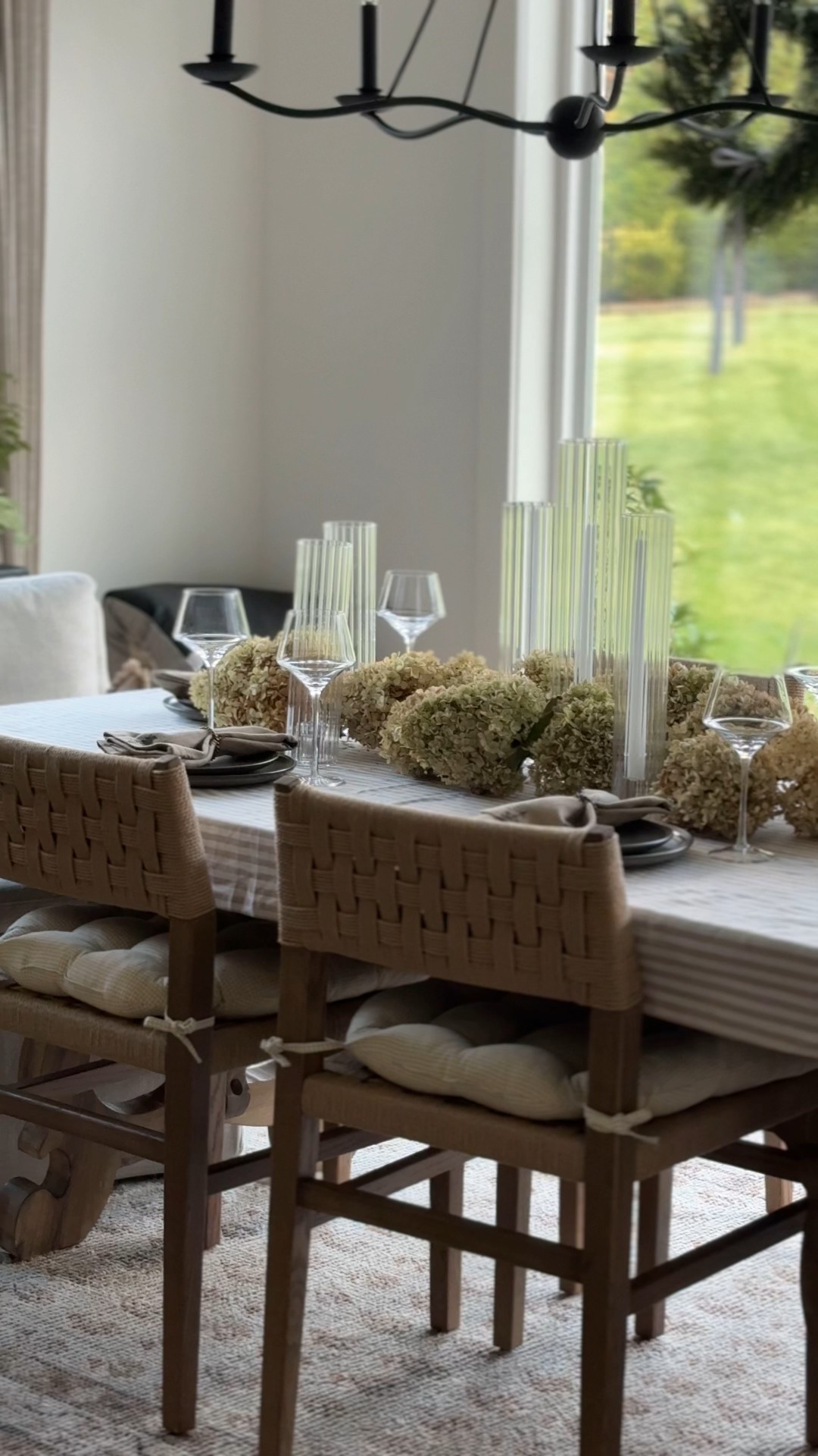 Neutral Thanksgiving tablescape perfection 🤍🍂 I kept this look simple and elevated with dried hydrangeas, tall ribbed glass candle holders, layered stoneware plates, and soft woven seating. It’s the easiest way to make your holiday hosting feel warm, cozy, and high-end without doing too much. Linking the candles, holders, plates, napkins, chairs, and table linens so you can recreate this full setup at home.

#ltkhome #thanksgivingdecor #holidayhosting #neutralhome #tablescapeideas #falltablescape #cozyhomevibes #ltkholiday 

 #LTKHoliday #LTKSeasonal #LTKHome