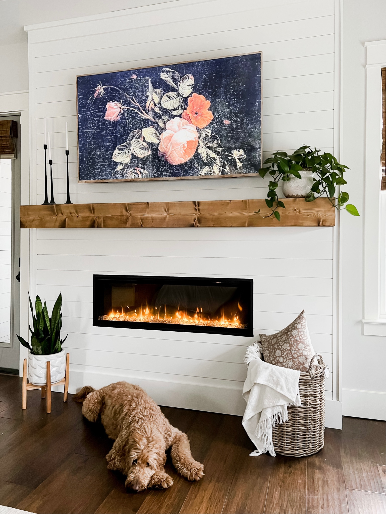 Primary master bedroom home decor design accessories accents electric fireplace dimplex woven, bamboo blinds, shades, wooden mantle, planter, basket, throw pillow frame, TV, dupe, black iron candlesticks mantel

#LTKFind #LTKhome #LTKSeasonal