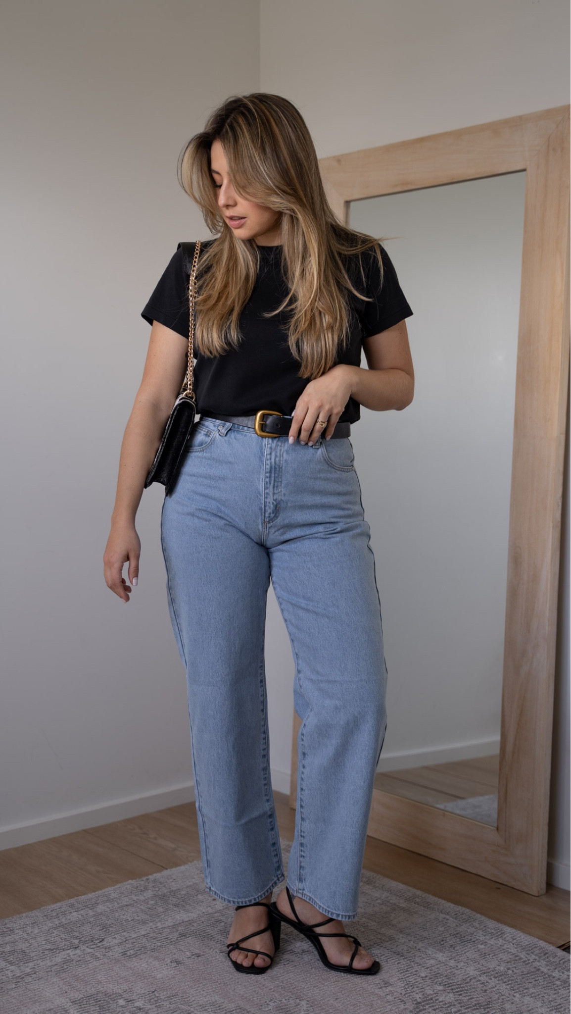 - I am wearing a size 10 in the jeans 
- size M in the t-shirt 
- bag is by designer Paulina Gutierrez 