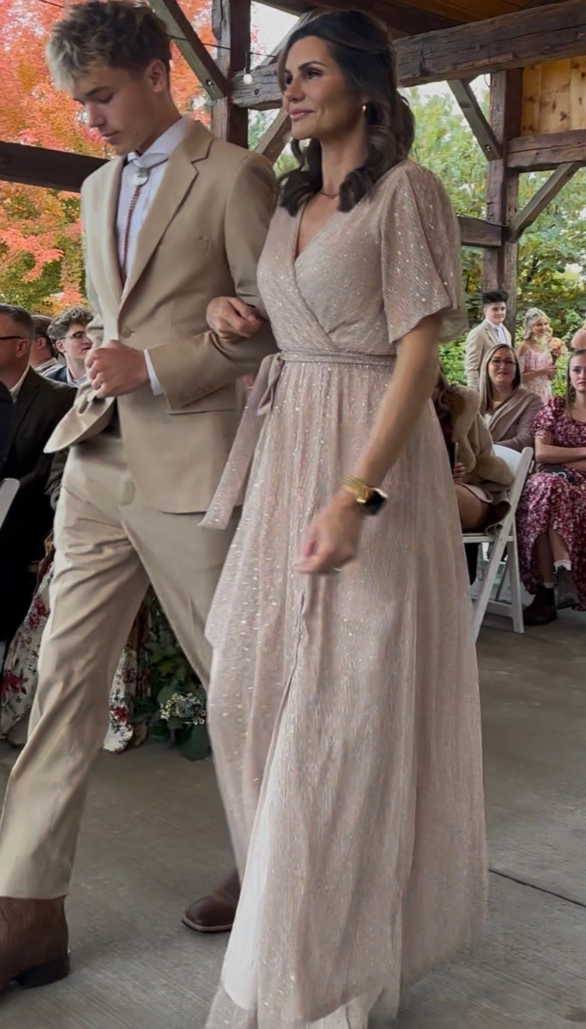 Mother of the bride dress. 

A one-of-a-kind dress for the special moments in life
Classic champagne color
Vine embossed organza material
Fabric has a structured feel with no stretch
Crossover surplice neckline
Short unlined sleeves to showcase the vine design
Elastic waistband with separate waist tie
Maxi length with slit at left leg
Fully lined with inverted lining; seam is sewn outside
Slightly sheer - we recommend pairing with a slip
Bump and nursing friendly
Hemline of this style is raw cut
100% Polyester

#LTKWedding