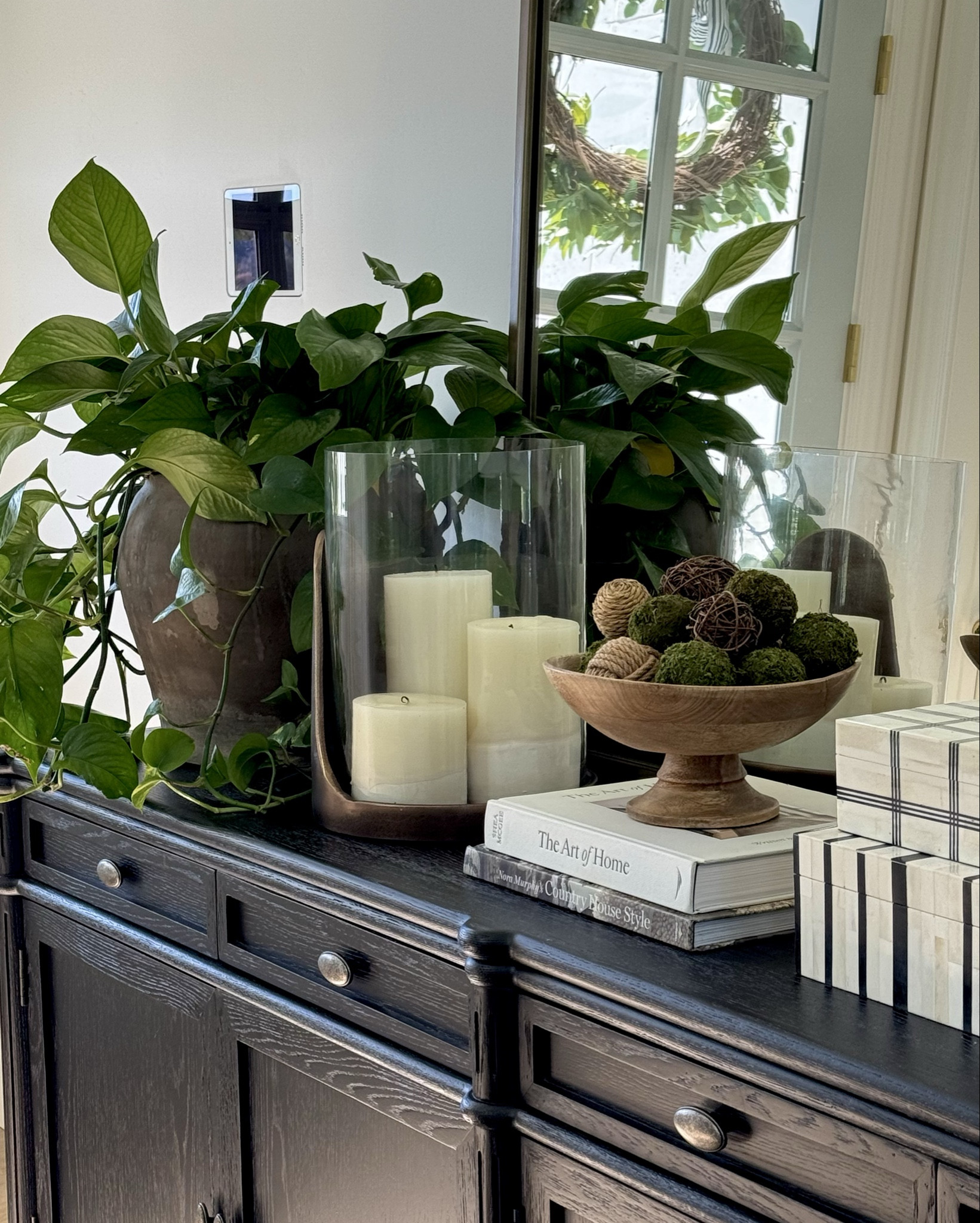 This new antique candle holder is stunning all year, but I’m super excited for it for the upcoming holidays! This sideboard is one of my favorite furniture pieces in my home! It has amazing storage and I love the feet and door details. The stacking boxes are such a unique find! I have them in several locations in my home. I also love this oversize arch mirror that is it such a great price point!

#LTKFallSale #LTKHome #LTKSaleAlert