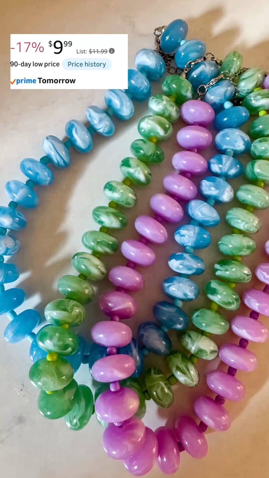 Statement necklace | colorful jewelry | summer jewelry | resin choker necklace | Amazon jewelry find

Found the blue, green, and purple resin chokers all in stock with Prime shipping, and they are all under $10 right now.

These are exactly the kind of Amazon jewelry finds that make a simple summer outfit look styled in one step. The chunky resin beads, glossy finish, marble swirl detail, bold color, adjustable choker fit, and retro-inspired shape make them feel playful, polished, and way more expensive than the price.

The purple feels fun and feminine, the blue is so good with white dresses and coastal outfits, and the green gives that fresh resort jewelry look that works beautifully with linen, cotton dresses, beach vacation outfits, and colorful summer looks.

These are the pieces I would grab for summer dresses, maxi dresses, button downs, swimsuits and coverups, tank tops, white tees, vacation outfits, resort dinners, girls trips, brunch, poolside lunches, cruises, beach trips, and any outfit that needs one strong accessory.

If you love colorful jewelry, statement necklaces, chunky necklaces, resin jewelry, beaded chokers, summer accessories, vacation jewelry, resort jewelry, Palm Beach style, preppy summer outfits, and affordable Amazon finds, these are such easy add-ons while all three colors are in stock.

statement necklace, colorful jewelry, summer jewelry, Amazon jewelry, Amazon jewelry finds, resin choker, resin necklace, chunky necklace, beaded necklace, purple necklace, blue necklace, green necklace, colorful necklace, statement jewelry, summer accessories, vacation jewelry, resort jewelry, beach vacation outfit, tropical vacation outfit, cruise outfit, Palm Beach style, preppy summer outfit, outfit accessories, affordable jewelry, jewelry under 10, Prime shipping jewelry

#LTKFindsUnder50 #LTKFindsUnder100 #PreppyStyle #WorkOutfit #LookForLess #TeacherOutfit #SummerOutfits #BeadedNecklace #StatementNecklace #ColorfulNecklace

#LTKSaleAlert #LTKOver40 #LTKSeasonal