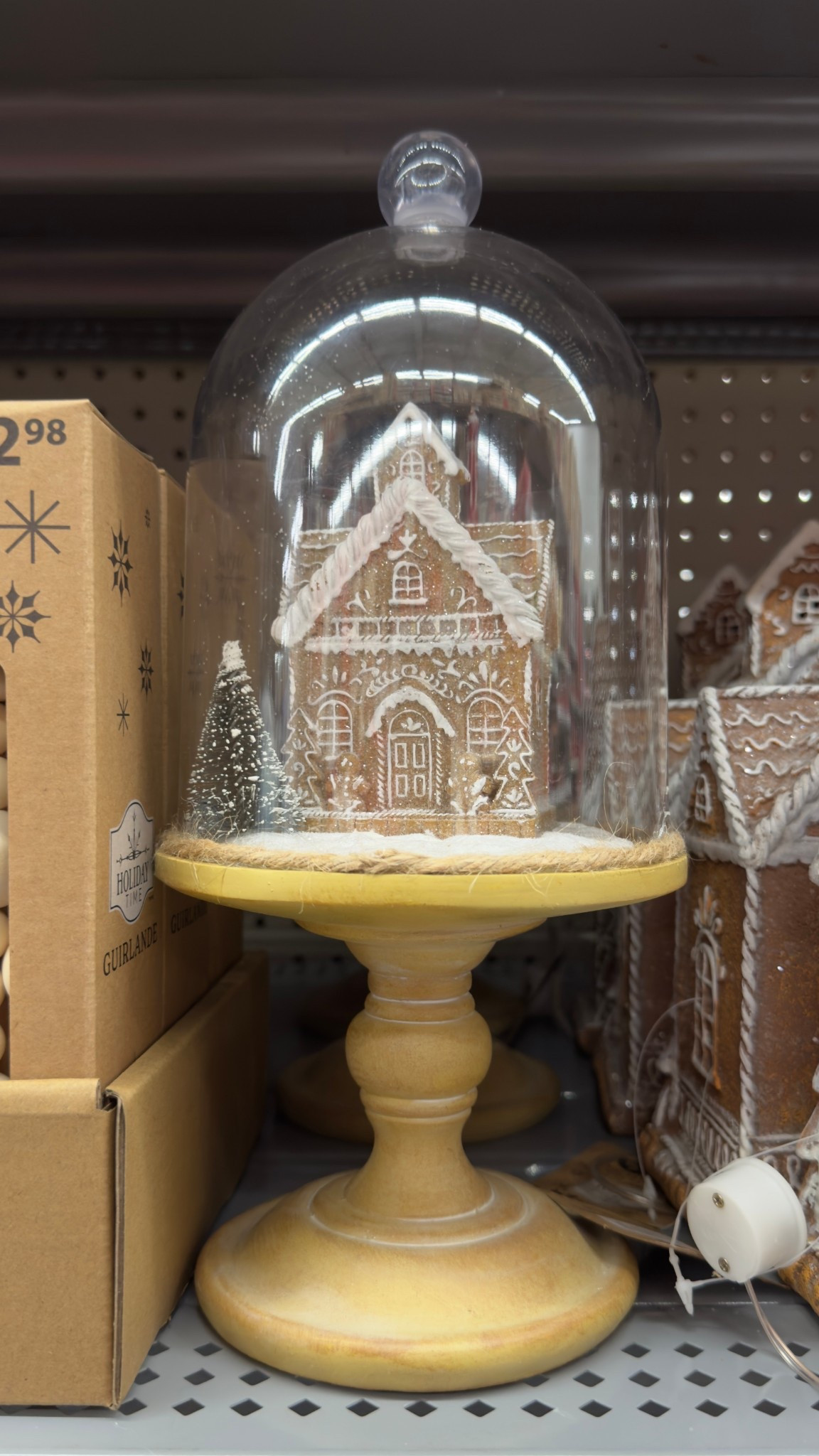 Spotted in Walmart: Cute gingerbread decor, Christmas decoration. Gingerbread house and glass cloche. Great for styling in a kitchen or on a bookshelf

#LTKhome #LTKwinter #LTKcanada